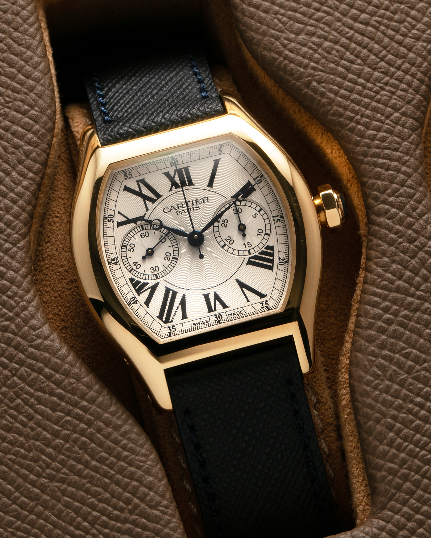 Brand: Cartier Year: 2000’s Model: Collection Privée Cartier Paris Tortue Monopoussoir Reference: 2356E Material: 18-carat Yellow Gold Movement: Cartier THA Cal. 045MC, Manual-Winding Case Diameter: 43mm x 35 mm Lug Width: 18mm Strap: Molequin Navy Blue Textured Calf Leather with Signed 18-carat Yellow Gold Deployant Clasp