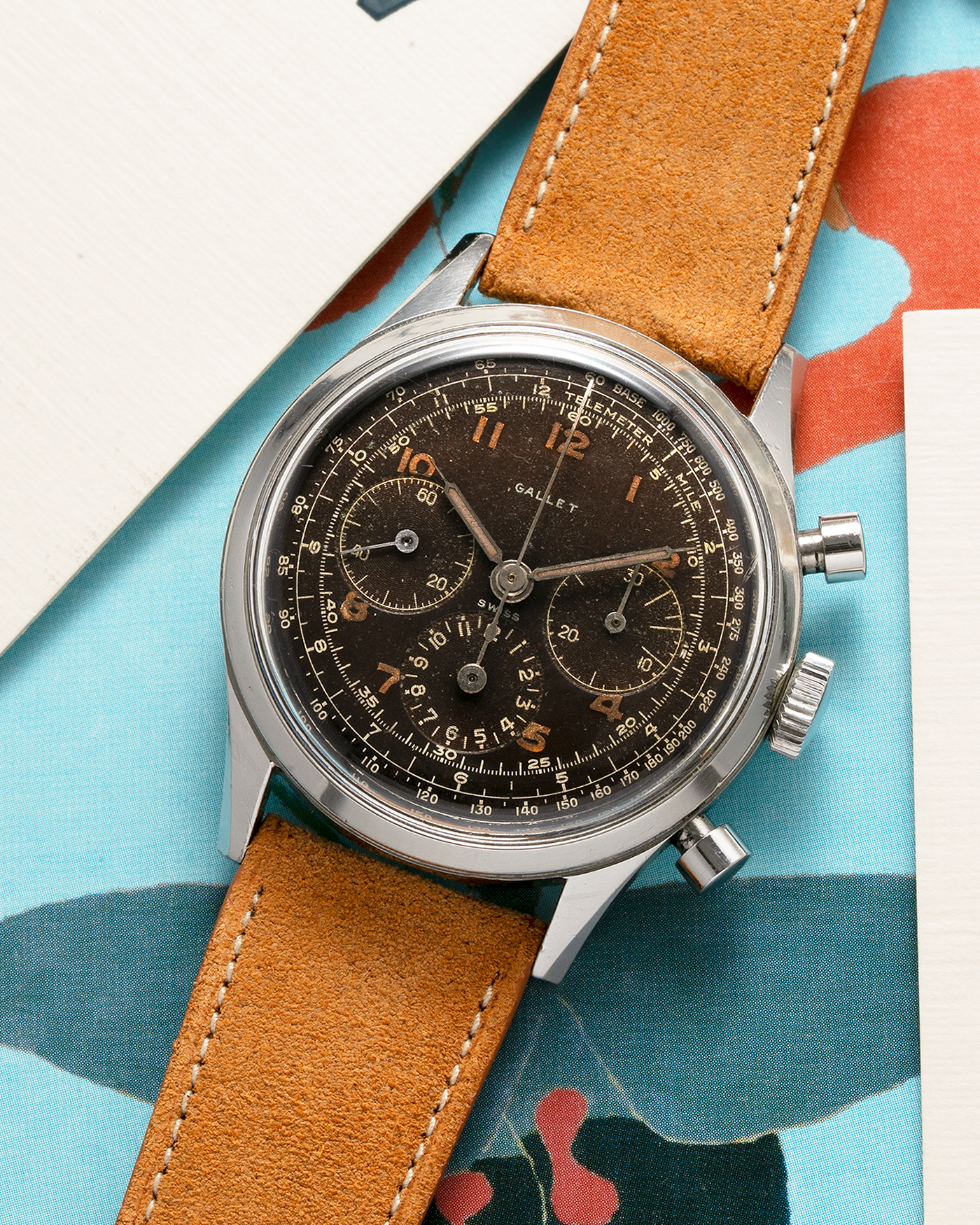 Brand: Gallet Year: 1950’s Model: Mutichron 12H Chronograph Serial Number: 933631 Material: Stainless Steel Movement: Excelsior Park 40, Manual-Winding Case Diameter: 37mm Strap: Nostime Sand Tan Suede Calf Leather Strap