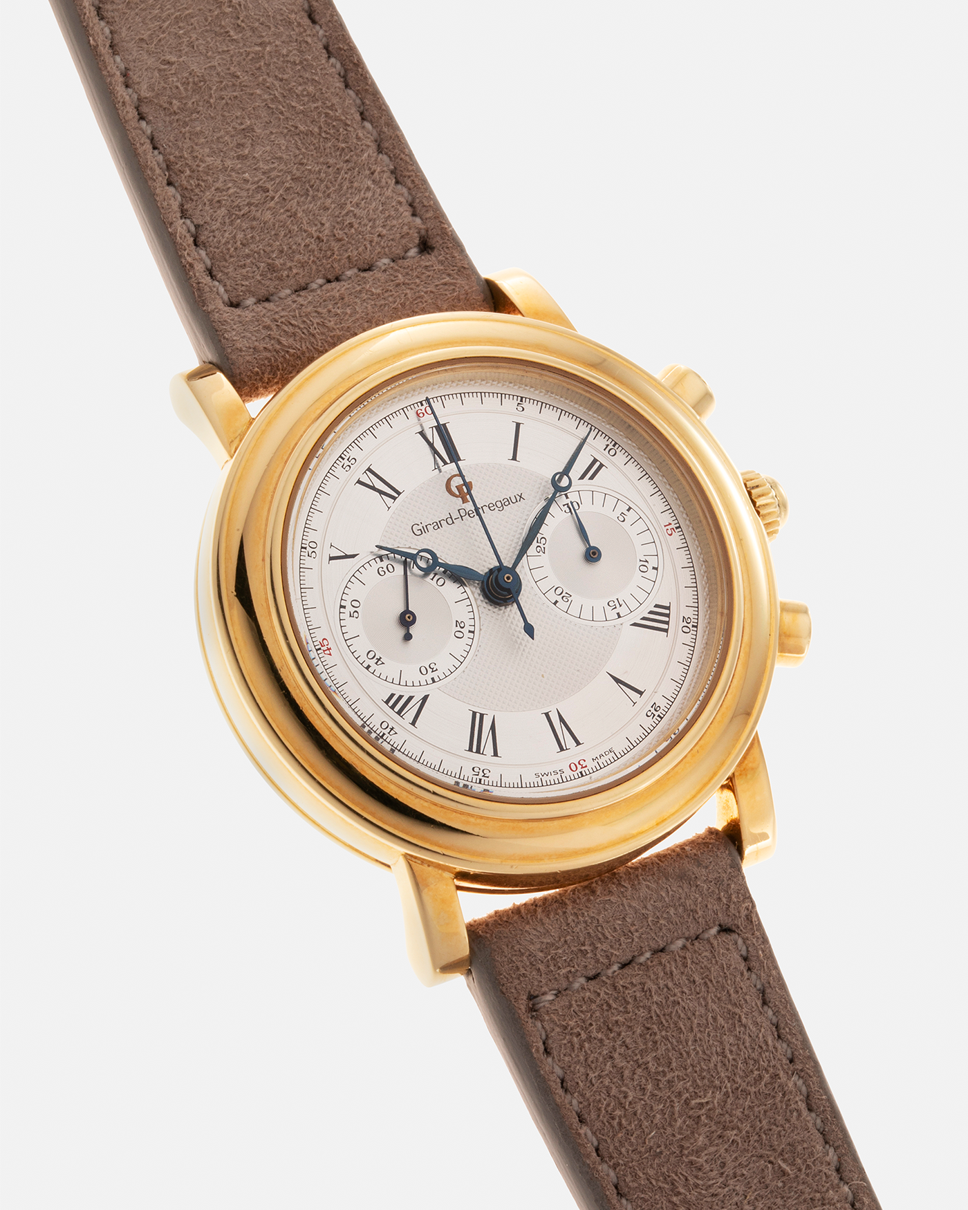 Brand: Girard Perregaux Year: 1990’s Reference Number: 47930 Material: 18k Yellow Gold Movement: Lemania Cal. 1872  Case Diameter: 38mm Strap: Molequin Taupe Suede Strap and 18k Yellow Gold Girard Perregaux Tan Buckle