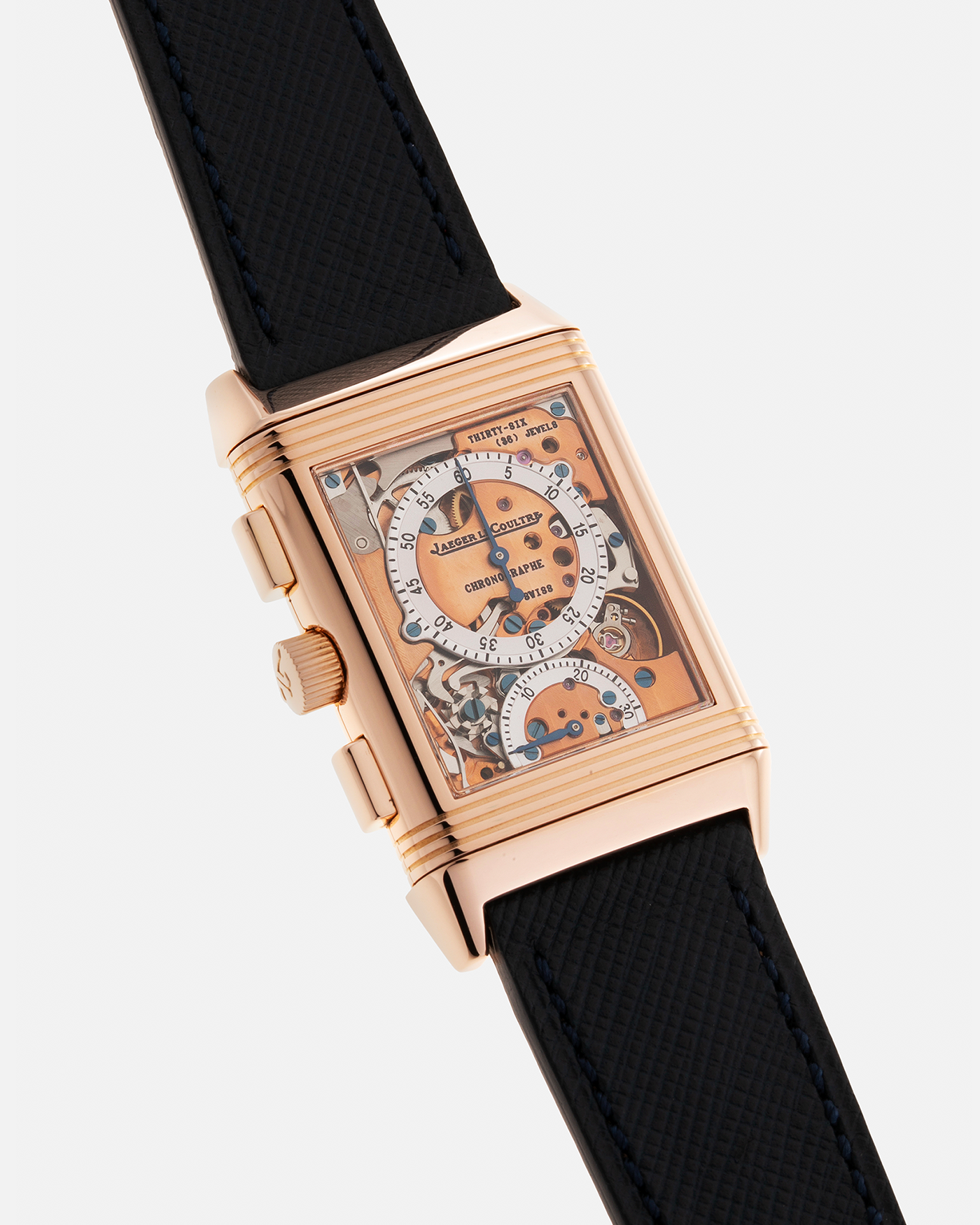 Brand: Jaeger LeCoultre Year: 1996 Model: Reverso Chronographe Retrograde, Limited to 500 pieces Reference: 270.2.69 Material: 18-carat Rose Gold Movement: JLC Cal. 829, Manual-Wind Case Diameter: 42mm x 26mm x 9.5mm Strap: Molequin Navy Blue Textured Calf with Signed 18-carat Rose Gold Deployant Clasp