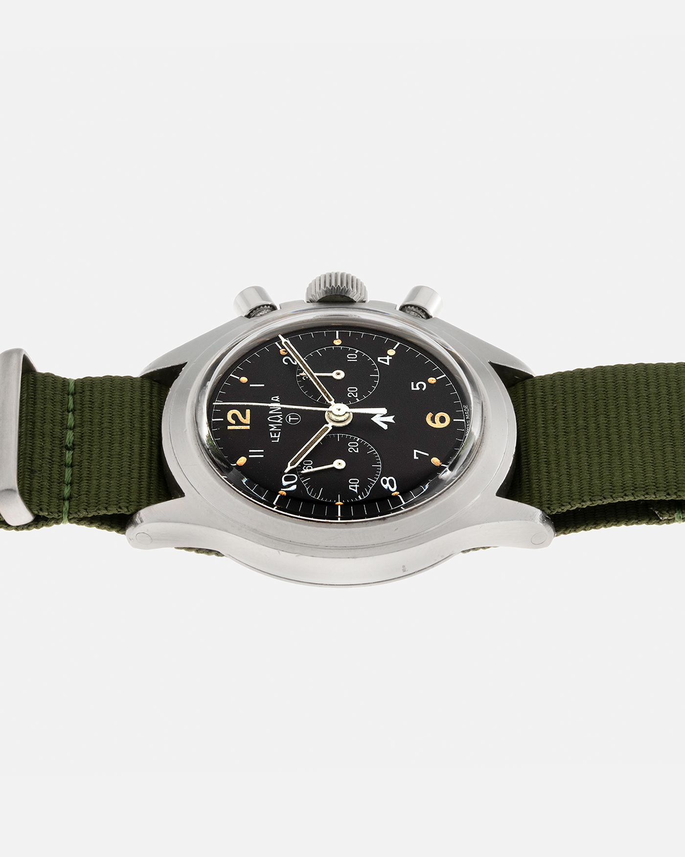 Brand: Lemania Year: 1975 Model: ‘Double Pusher’ Royal Navy Chronograph, Estimated 500 pieces only Reference Number: 818 Material: Stainless Steel Movement: Lemania 2220, Manual-Winding Case Diameter: 40mm Lug Width: 20mm Strap: Auricoste Military Green NATO Strap
