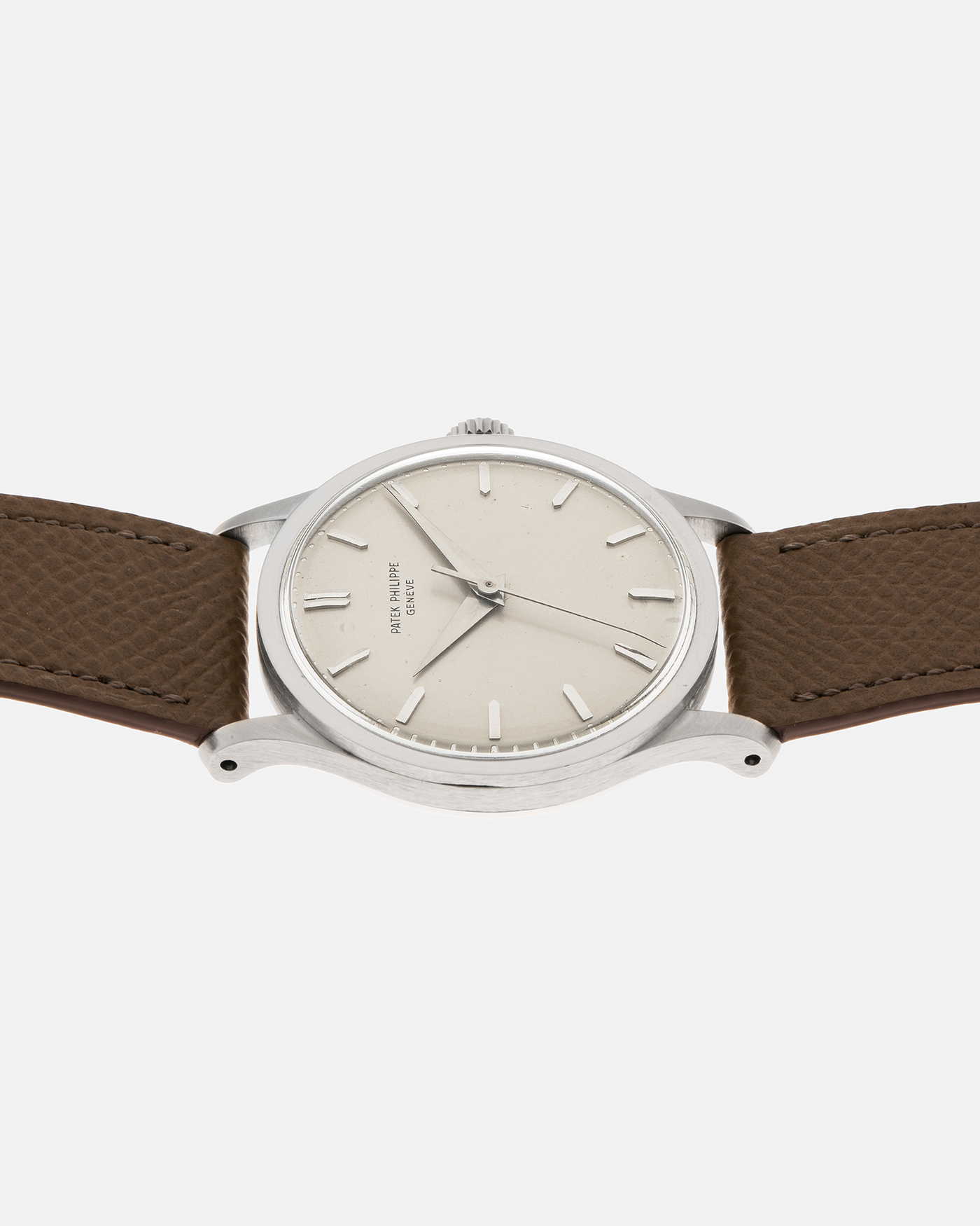Brand: Patek Philippe Year: 1965 Model: Calatrava Reference: 570 Material: 18-carat White Gold Movement: Patek Philippe Cal. 27 SC, Manual-Winding Case Diameter: 35.5mm Lug Width: 20mm Strap: Nostime Taupe Grained Calf Leather Strap, additional Generic Black Alligator Leather Strap with Signed 18-carat White Gold Tang Buckle