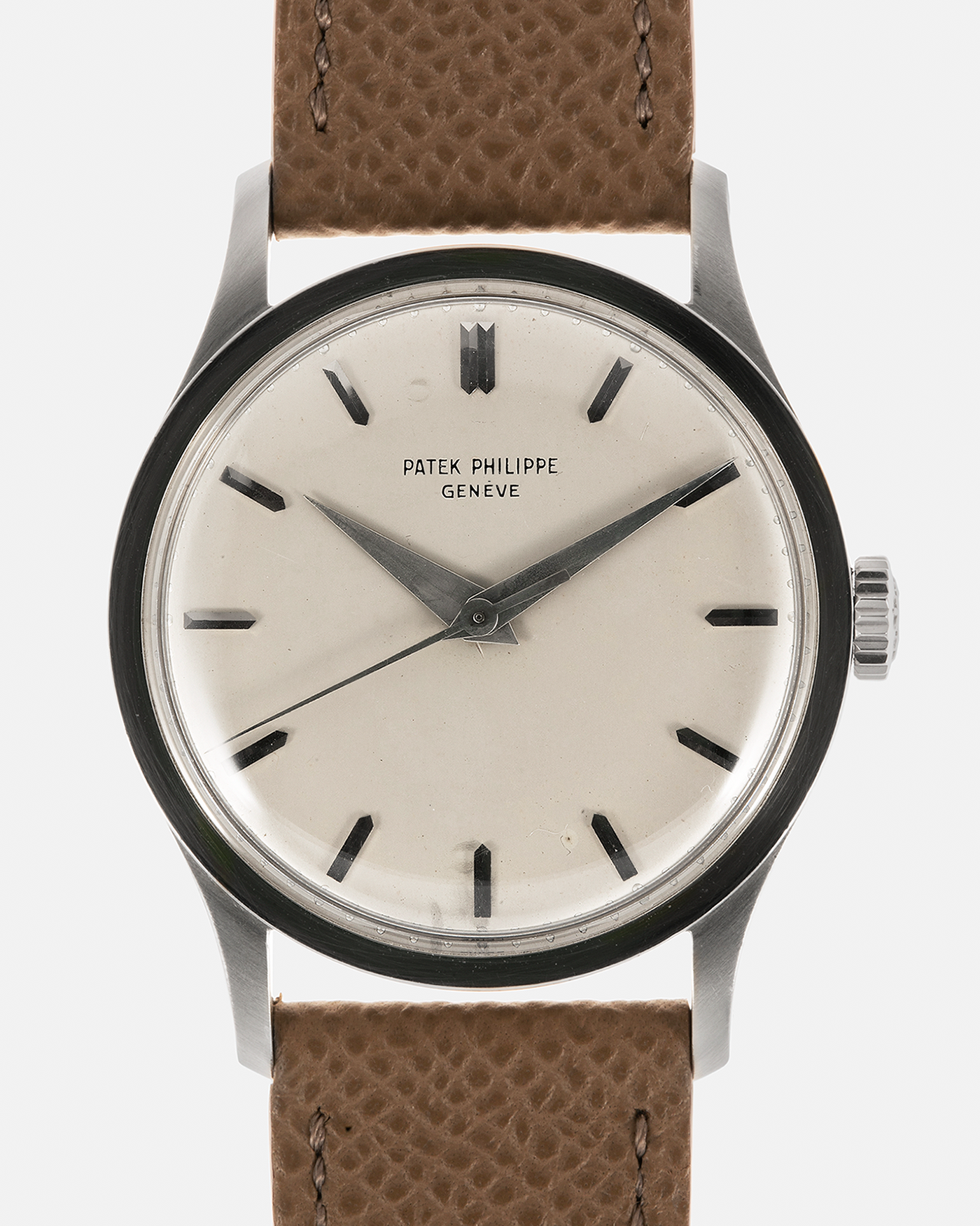 Brand: Patek Philippe Year: 1965 Model: Calatrava Reference: 570 Material: 18-carat White Gold Movement: Patek Philippe Cal. 27 SC, Manual-Winding Case Diameter: 35.5mm Lug Width: 20mm Strap: Nostime Taupe Grained Calf Leather Strap, additional Generic Black Alligator Leather Strap with Signed 18-carat White Gold Tang Buckle