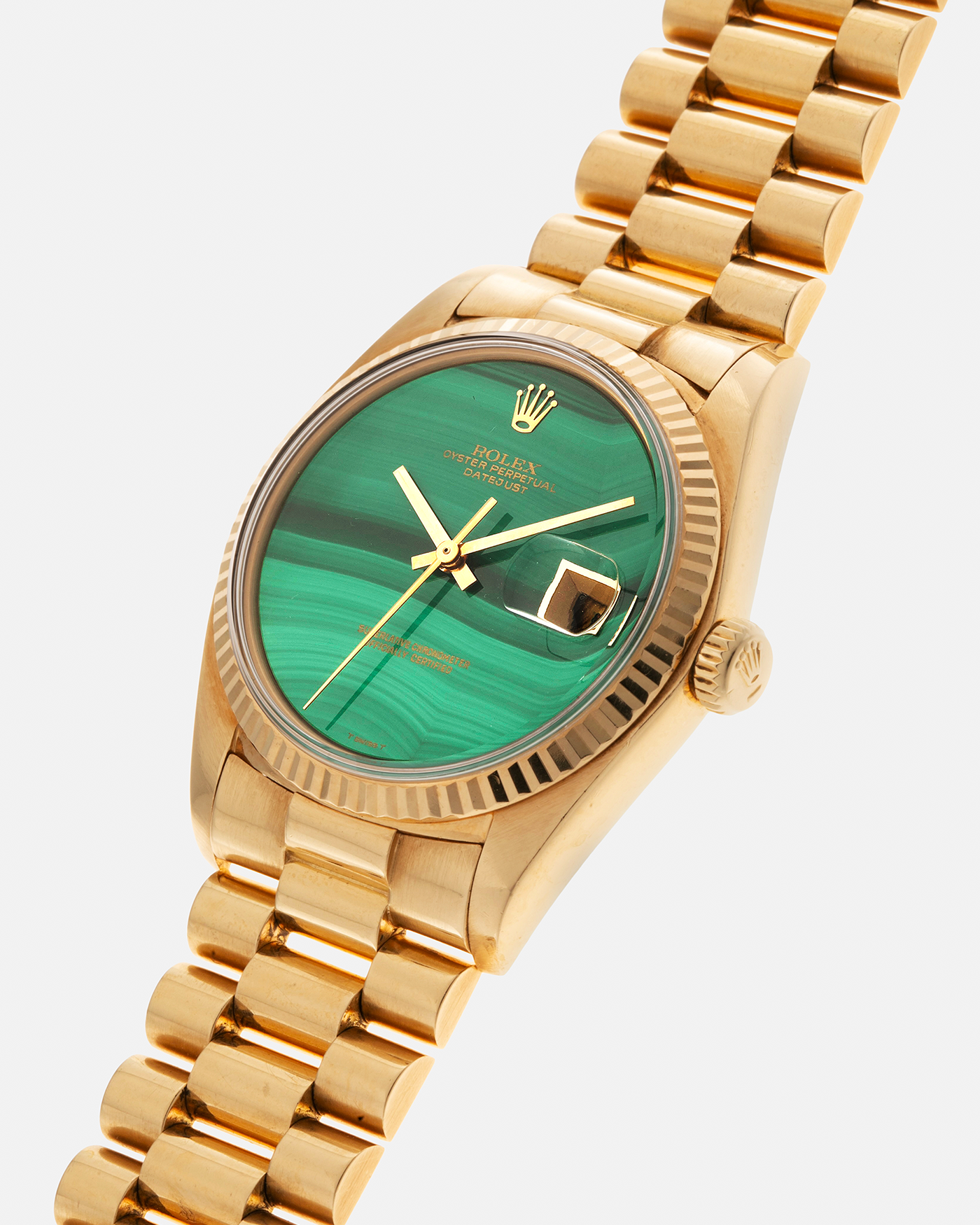 Brand: Rolex Year: 1976 Model: Datejust Reference Number: 1601 Serial Number: 420XXXX Material: 18-carat Yellow Gold, Malachite Stone Dial Movement: Rolex Cal. 1570, Self-Winding Case Diameter: 36mm Lug Width: 20mm Bracelet: Rolex Presidential Bracelet in 18-carat Yellow Gold with Signed Clasp