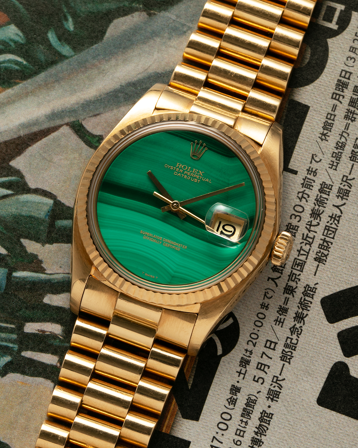 Brand: Rolex Year: 1976 Model: Datejust Reference Number: 1601 Serial Number: 420XXXX Material: 18-carat Yellow Gold, Malachite Stone Dial Movement: Rolex Cal. 1570, Self-Winding Case Diameter: 36mm Lug Width: 20mm Bracelet: Rolex Presidential Bracelet in 18-carat Yellow Gold with Signed Clasp