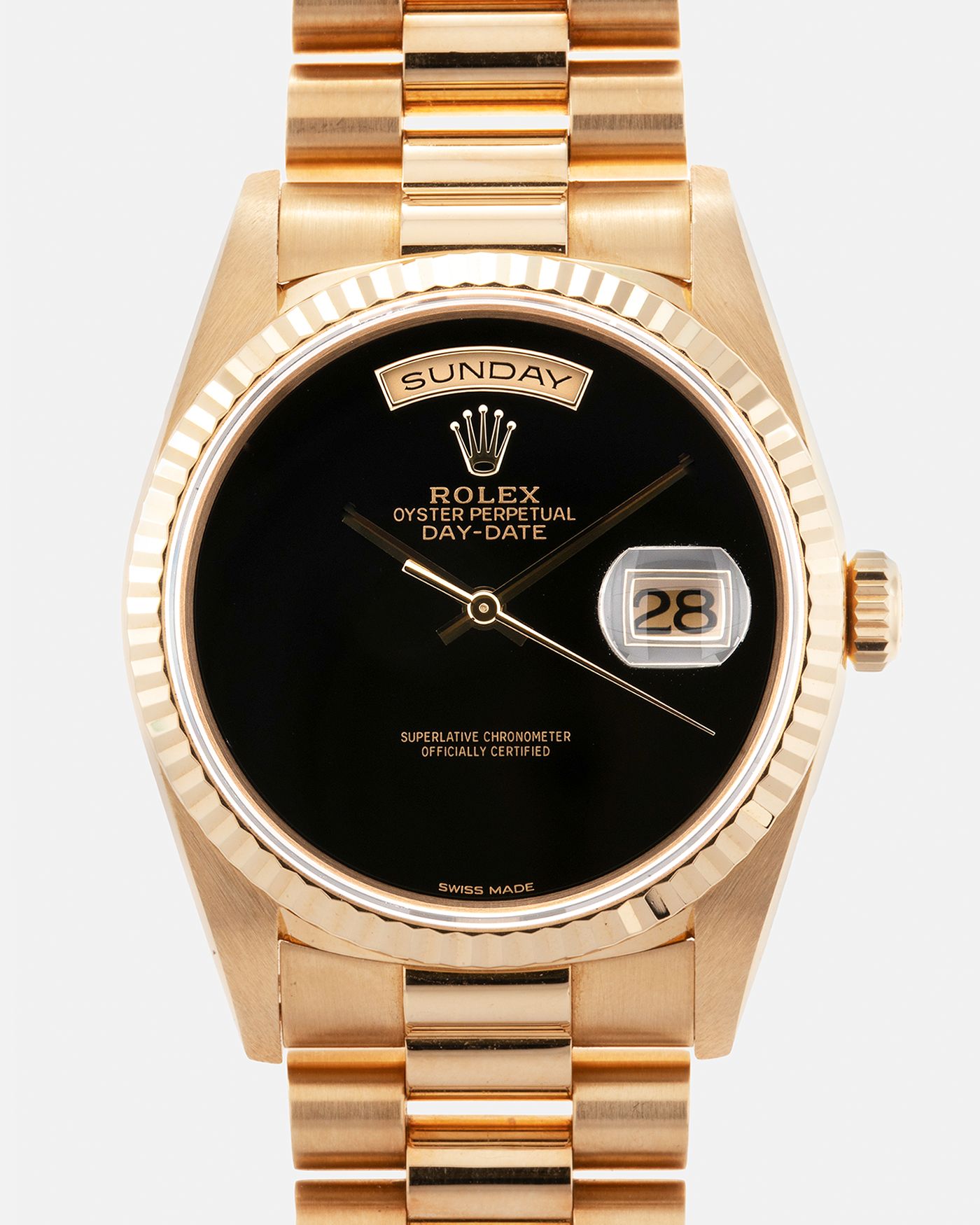 Brand: Rolex Year: 1996 Model: Day Date Reference Number: 18238 Serial Number: W409XXX Material: 18-carat Yellow Gold, Black Onyx Dial Movement: Rolex Cal. 3155, Self-Winding Case Diameter: 36mm Lug Width: 20mm Bracelet: Rolex 18-carat Yellow Gold 8385 Presidential Bracelet with 55B Curved End Links