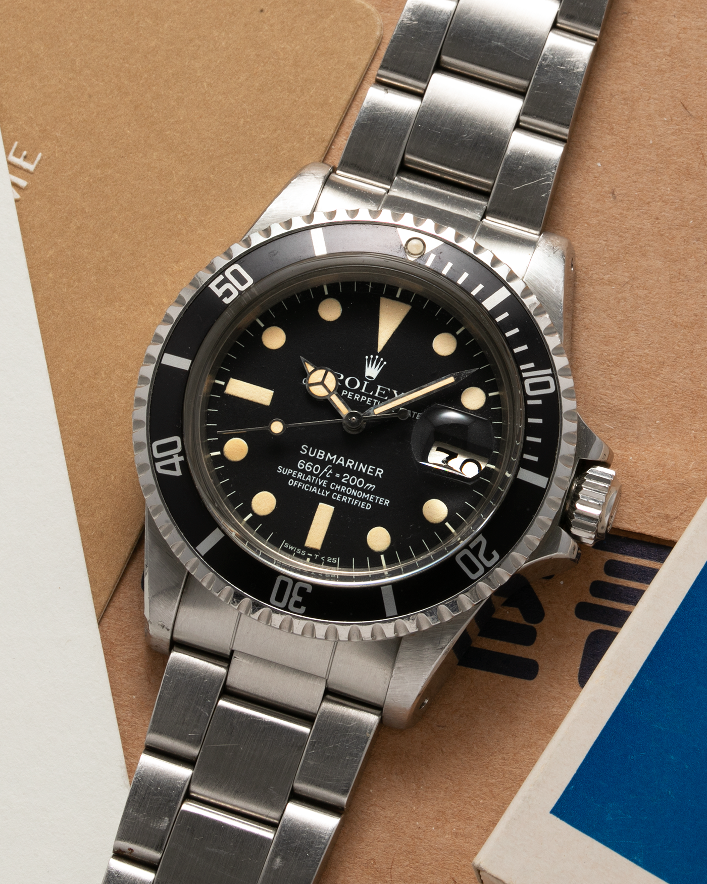 Brand: Rolex Year: 1978 Model: ‘White’ Submariner Reference Number: 1680 Serial Number: 529XXXX Material: Stainless Steel Movement: Rolex Cal. 1575, Self-Winding Case Diameter: 39mm Lug Width: 20mm Bracelet: Rolex Stainless Steel ‘93150’ Oyster bracelet with Signed ‘VB’ Clasp and ‘580’ Curved End Links