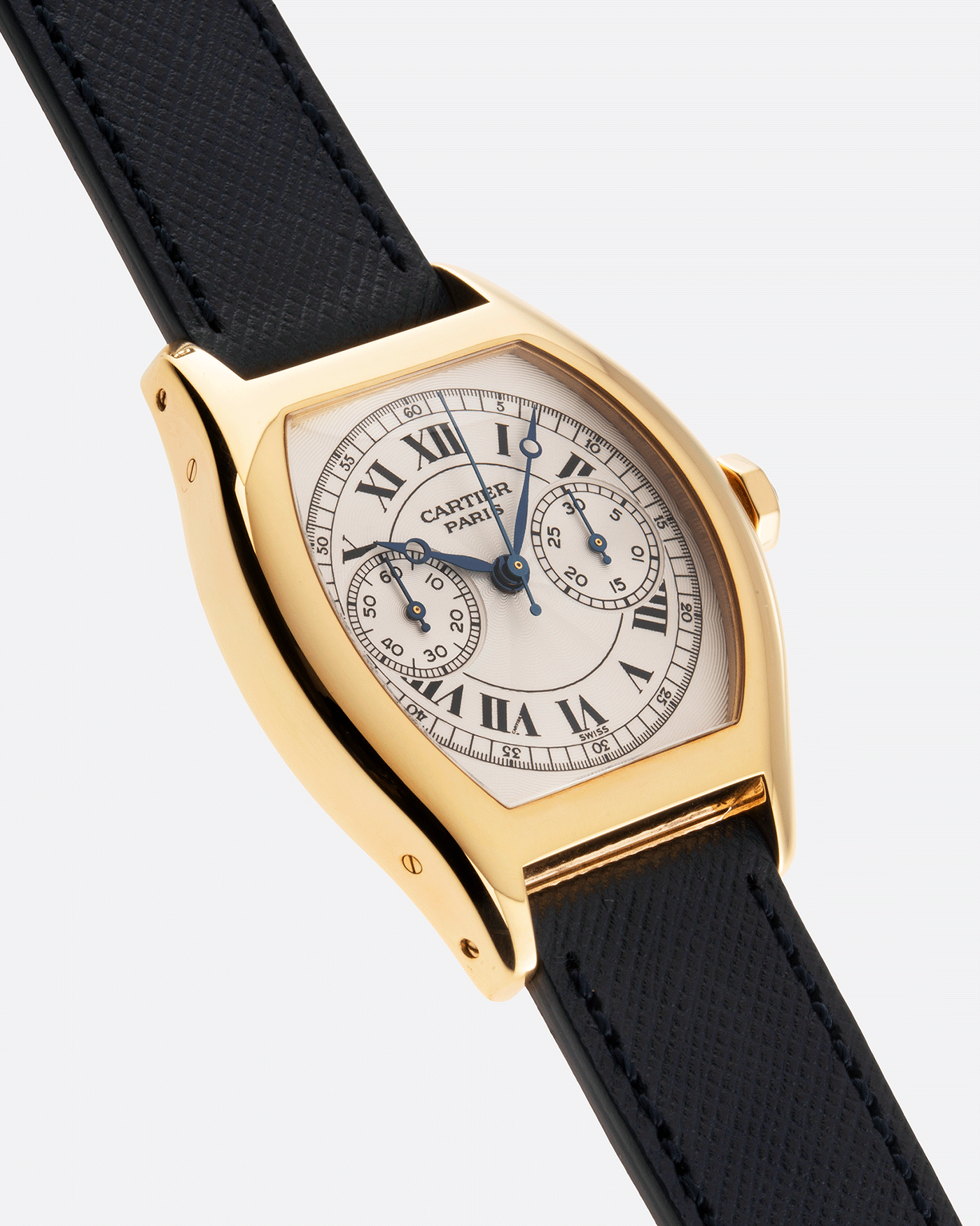 Brand: Cartier Year: 2000’s Model: CPCP Collection Prive Tortue Monopoussoir Reference: 2356E Material: 18k Yellow Gold Movement: THA Cal. 045MC Case Diameter: 43 x 35 mm Strap: Molequin Navy Blue Textured Calf with 18k Cartier Yellow Gold Deployant