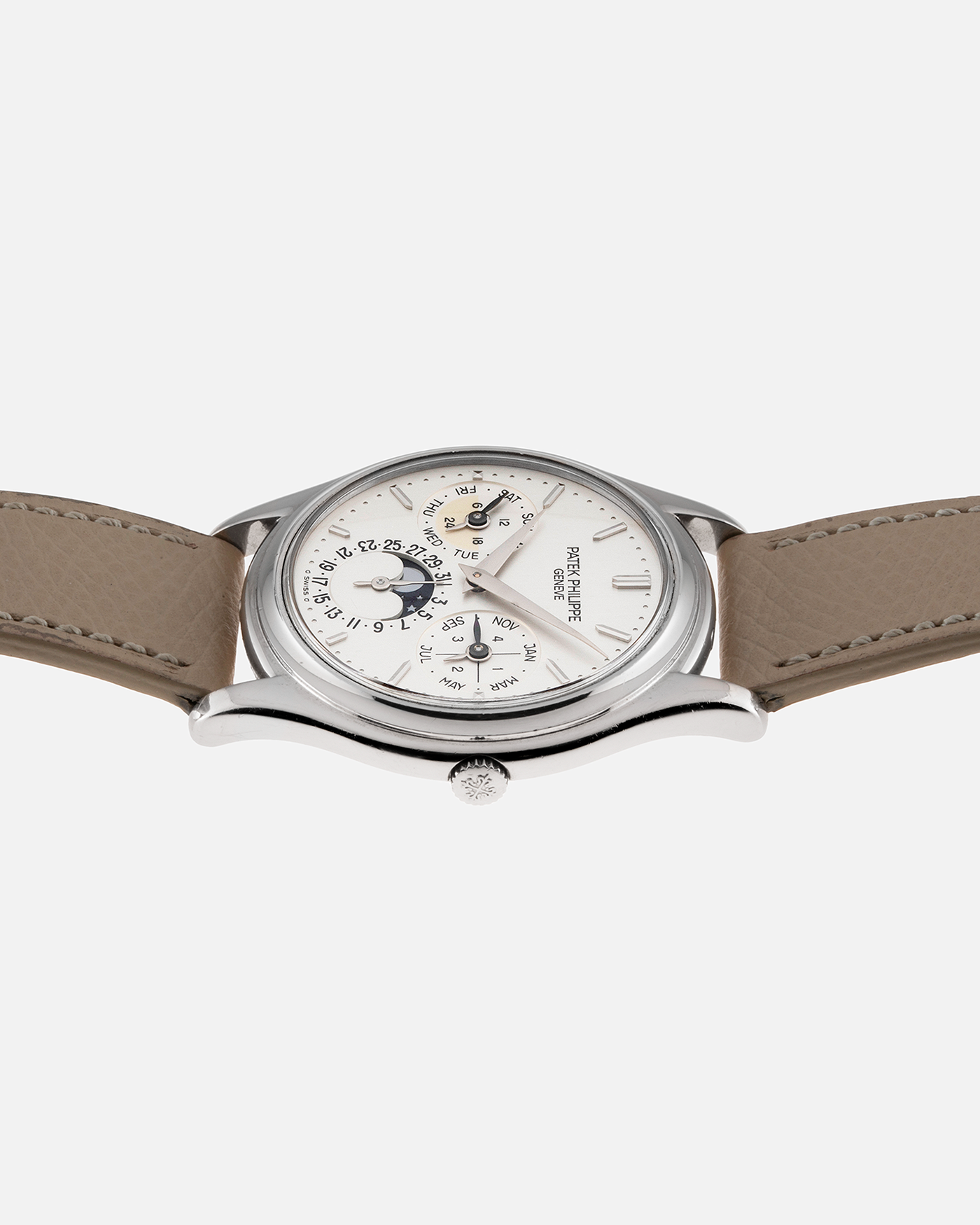 Brand: Patek Philippe Year: 1990’s Model: Perpetual Calendar Reference Number: 3940G Material: 18k White Gold Movement: Cal 240Q Case Diameter: 36mm Bracelet: Taupe Calf Leather Strap and 18k White Gold Patek Philippe Tang Buckle