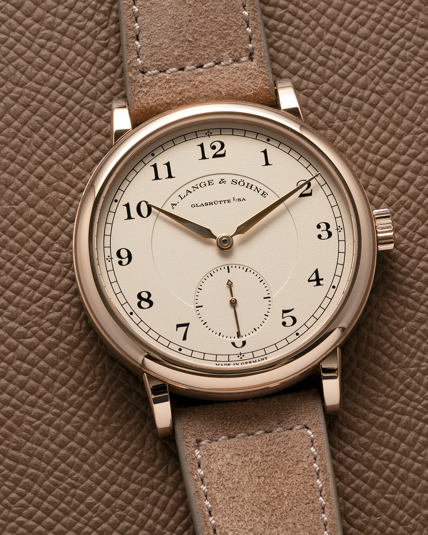 Brand: A. Lange & Söhne Year: 2015 Model: 1815 200th Anniversary F. A. Lange, Limited Edition of 200 pieces Ref Number: 236.050 Material: Honey Gold Movement: A. Lange & Söhne Cal. L051.1, Manual-Winding Case Diameter: 40m Lug Width: 20mm Strap: Molequin Taupe Suede Strap with Signed Honey Gold Tang Buckle, additional A. Lange & Söhne Black Alligator Leather Strap