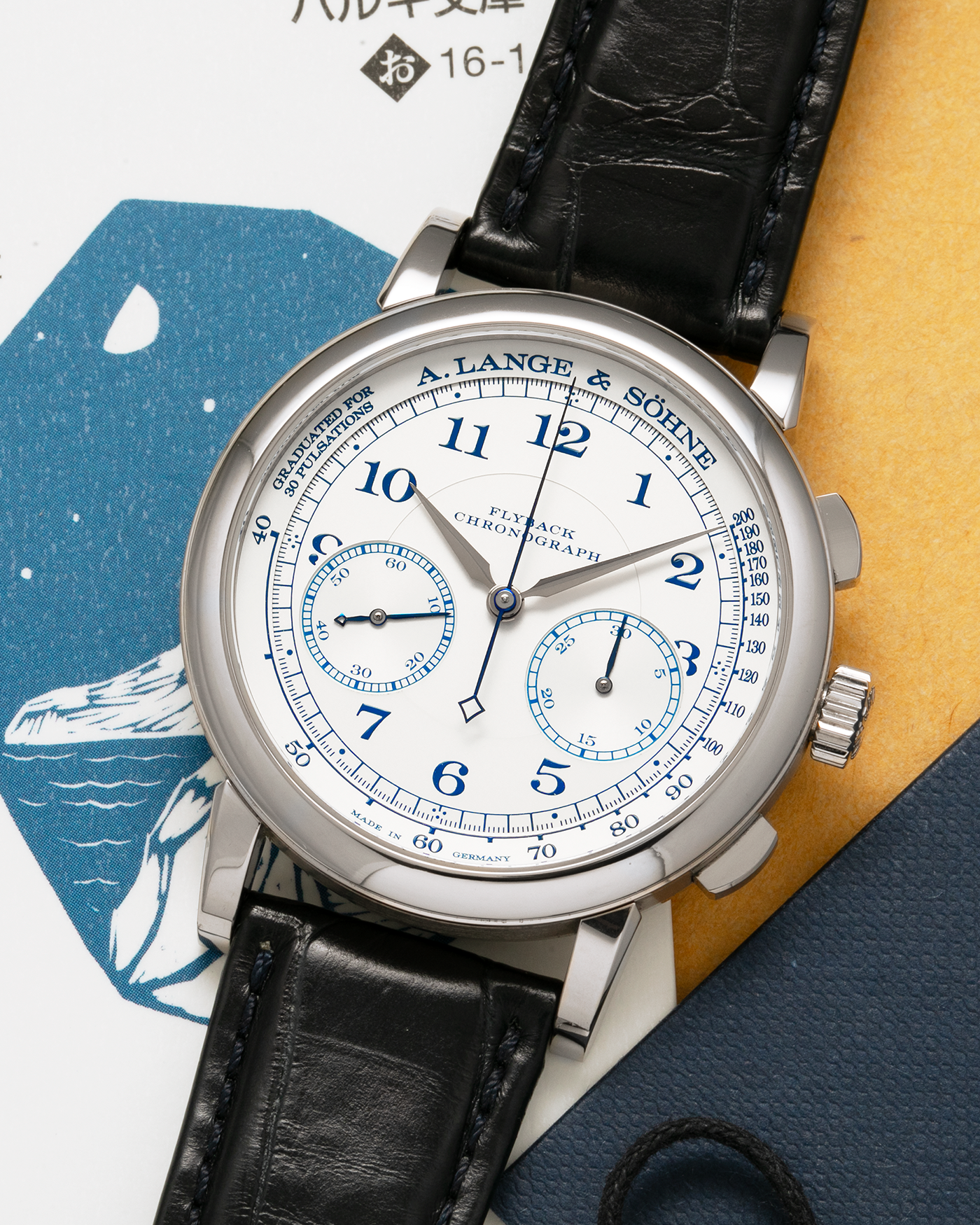 Brand: A. Lange & Söhne
Year: 2017
Model: 1815 Chronograph Boutique Edition
Reference Number: 414.026
Material: 18-carat White Gold
Movement: A. Lange & Söhne Cal. L951.5, Manual-Winding
Case Dimensions: 39.5mm x 11mm (Lug-to-Lug 48mm)
Lug Width: 20mm
Strap: A. Lange & Söhne Black Alligator Strap with signed 18-carat White Gold Tang Buckle