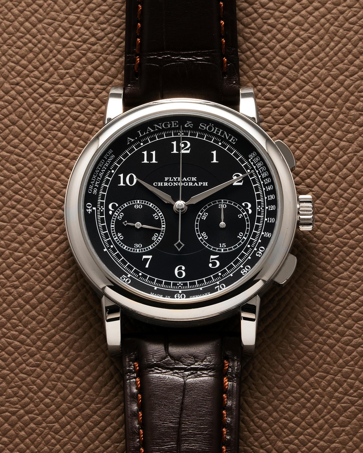 Brand: A. Lange & Söhne Year: 2022 Model: 1815 Chronograph Reference: 414.028 Material: 18-carat White Gold Movement: Cal. L951.5, Manual-Winding Case Diameter: 39.5mm Bracelet/Strap: A. Lange & Söhne Dark Brown Alligator Strap with signed 18-carat White Gold Tang Buckle