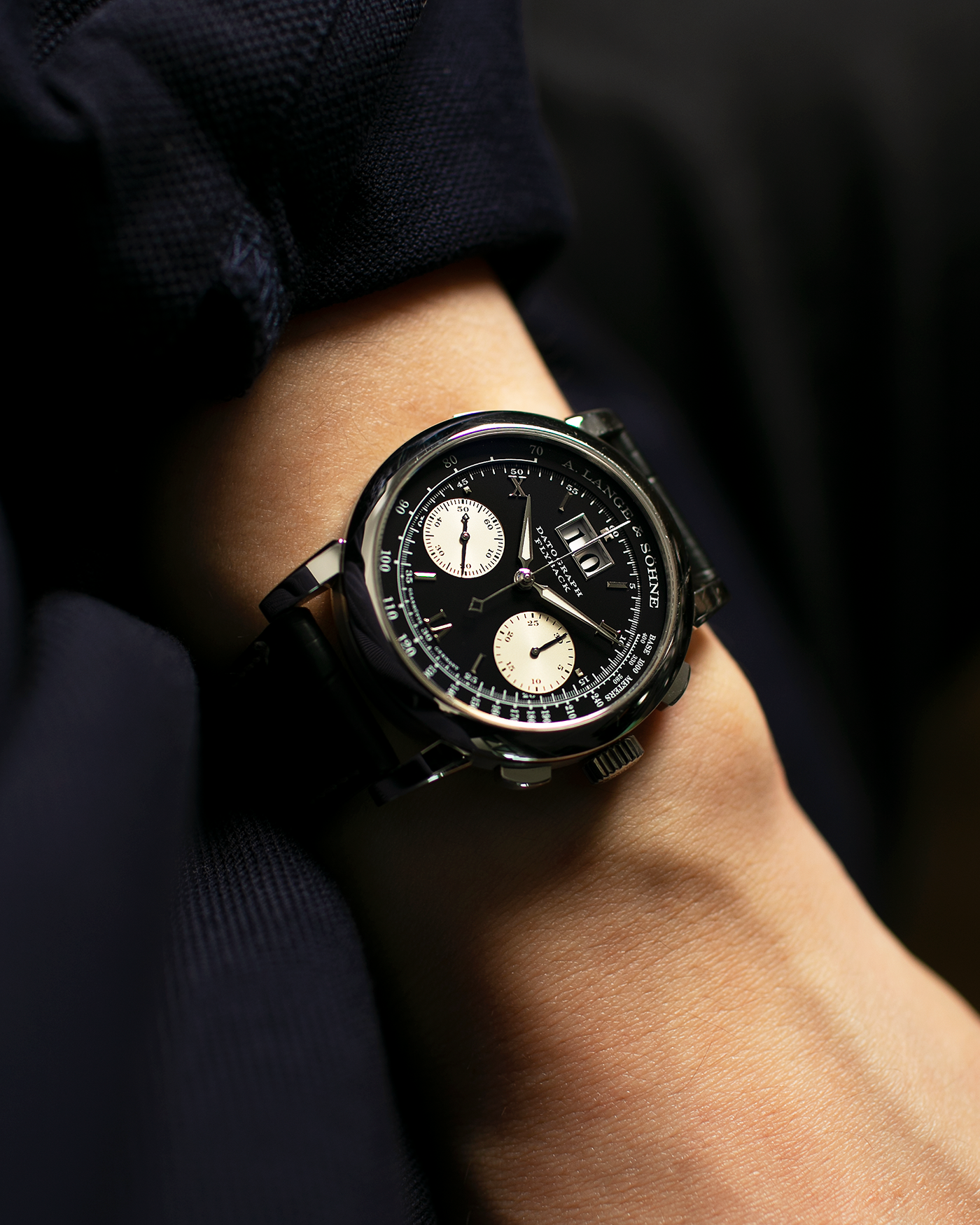 Brand: A. Lange & Söhne Year: 2007 Model: Datograph Reference Number: 403.035 Material: Platinum Movement: A. Lange & Söhne Cal. L951.1, Manual-Winding Case Diameter: 39mm Strap: A. Lange & Söhne Dark Grey Textured Calf with Signed Platinum Tang Buckle