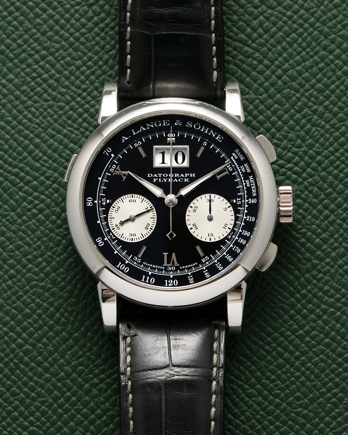 Brand: A. Lange & Söhne Year: 2007 Model: Datograph Reference Number: 403.035 Material: Platinum Movement: A. Lange & Söhne Cal. L951.1, Manual-Winding Case Diameter: 39mm Strap: A. Lange & Söhne Dark Grey Textured Calf with Signed Platinum Tang Buckle