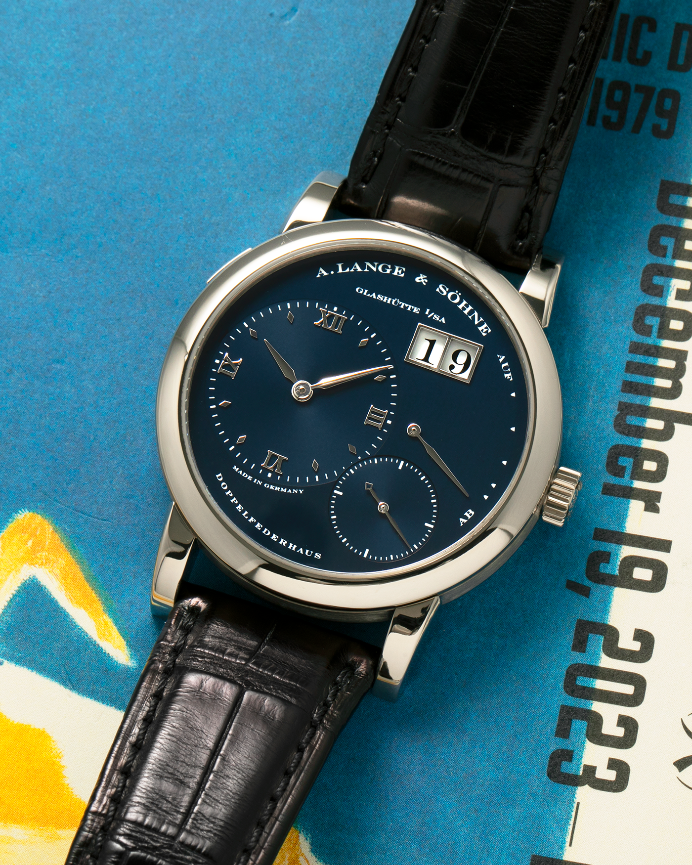 Brand: A. Lange & Söhne
Year: 2000’s
Model: Lange 1
Reference Number: 101.027
Material: 18-carat White Gold
Movement: A. Lange & Söhne Cal. L901.5, Manual Winding
Case Dimensions: 38.5mm x 9.5mm (Lug-to-Lug 47mm)
Lug Width: 20mm
Strap: A. Lange & Söhne Black Alligator Leather Strap with Signed 18-carat White Gold Tang Buckle