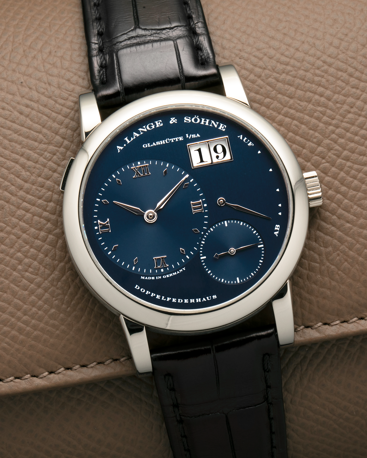 Brand: A. Lange & Söhne
Year: 2000’s
Model: Lange 1
Reference Number: 101.027
Material: 18-carat White Gold
Movement: A. Lange & Söhne Cal. L901.5, Manual Winding
Case Dimensions: 38.5mm x 9.5mm (Lug-to-Lug 47mm)
Lug Width: 20mm
Strap: A. Lange & Söhne Black Alligator Leather Strap with Signed 18-carat White Gold Tang Buckle
