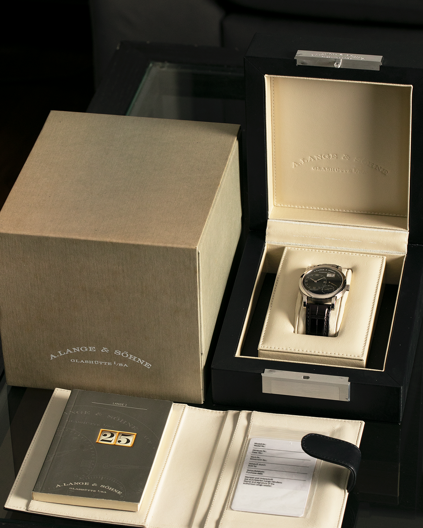 Brand: A. Lange & Söhne
Year: 2000’s
Model: Lange 1
Reference Number: 101.027
Material: 18-carat White Gold
Movement: A. Lange & Söhne Cal. L901.5, Manual Winding
Case Dimensions: 38.5mm x 9.5mm (Lug-to-Lug 47mm)
Lug Width: 20mm
Strap: A. Lange & Söhne Black Alligator Leather Strap with Signed 18-carat White Gold Tang Buckle