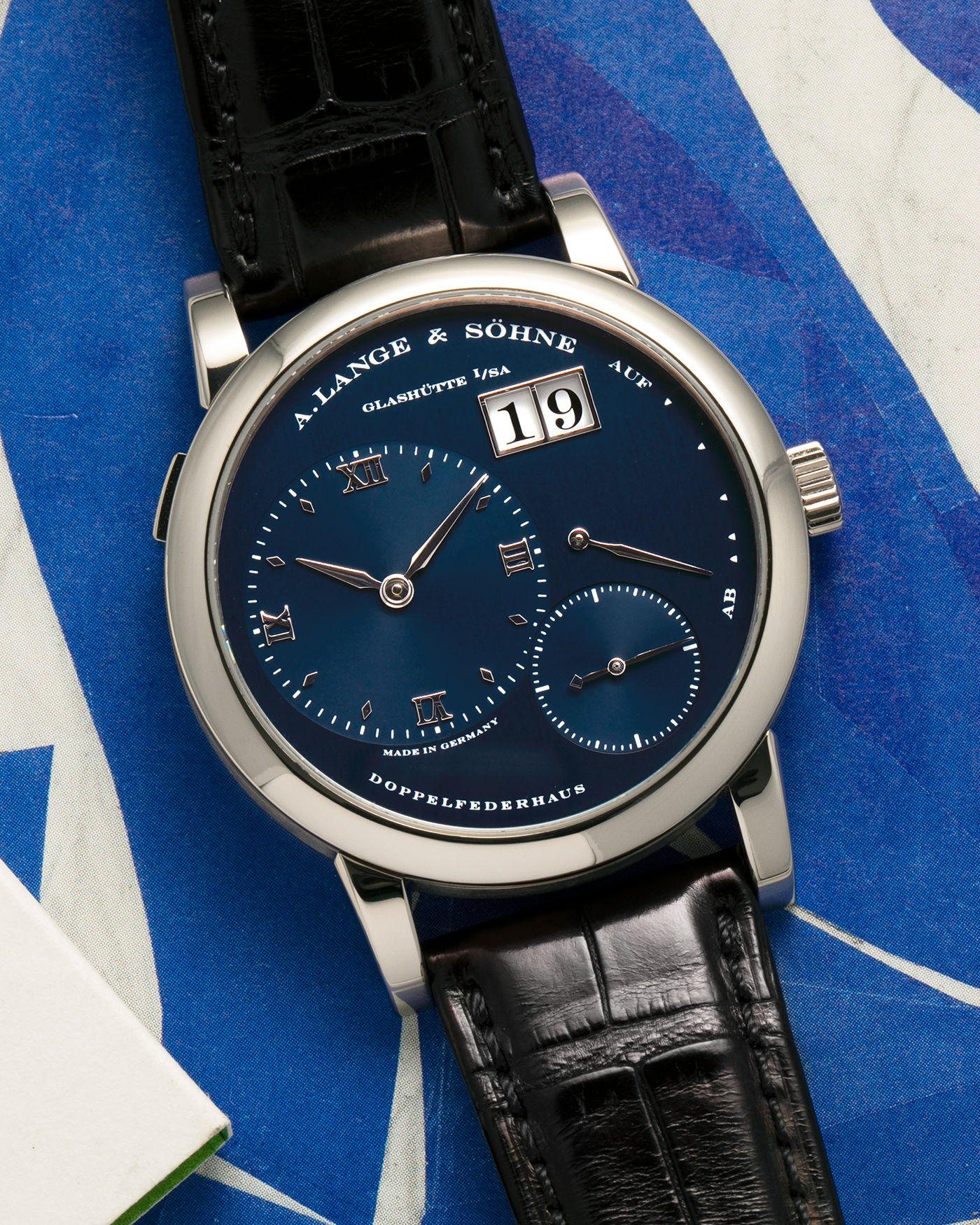 Brand: A. Lange & Söhne
Year: 2000’s
Model: Lange 1
Reference Number: 101.027
Material: 18-carat White Gold
Movement: A. Lange & Söhne Cal. L901.5, Manual Winding
Case Dimensions: 38.5mm x 9.5mm (Lug-to-Lug 47mm)
Lug Width: 20mm
Strap: A. Lange & Söhne Black Alligator Leather Strap with Signed 18-carat White Gold Tang Buckle