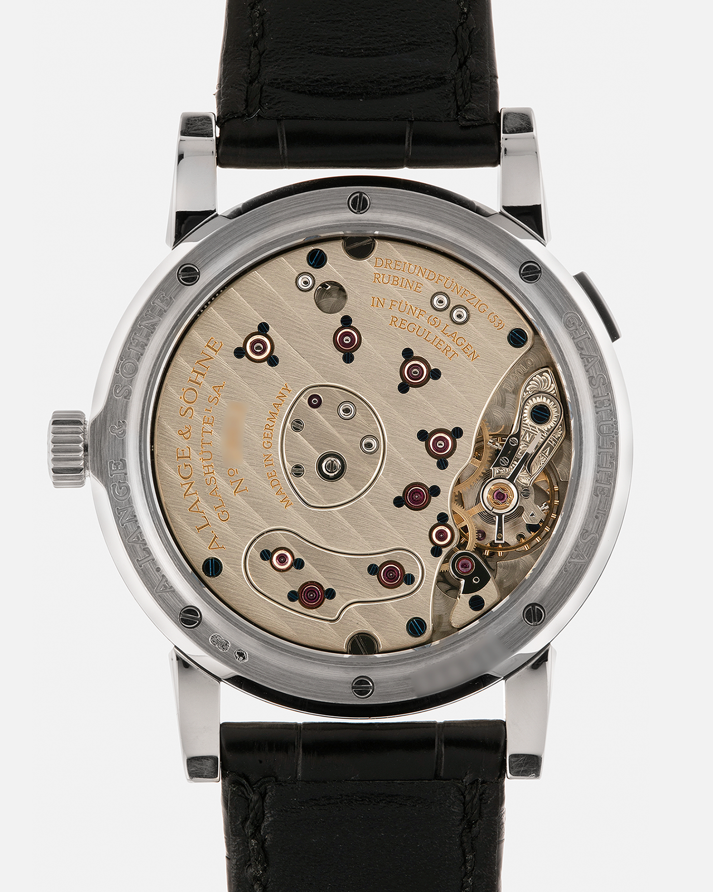 Brand: A. Lange & Söhne
Year: 2000’s
Model: Lange 1
Reference Number: 101.027
Material: 18-carat White Gold
Movement: A. Lange & Söhne Cal. L901.0, Manual Winding
Case Dimensions: 38.5mm x 9.5mm (Lug-to-Lug 47mm)
Lug Width: 20mm
Strap: A. Lange & Söhne Black Alligator Leather Strap with Signed 18-carat White Gold Tang Buckle