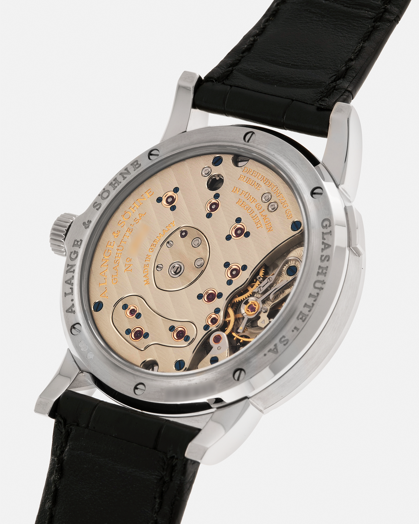 Brand: A. Lange & Söhne
Year: 2000’s
Model: Lange 1
Reference Number: 101.027
Material: 18-carat White Gold
Movement: A. Lange & Söhne Cal. L901.0, Manual Winding
Case Dimensions: 38.5mm x 9.5mm (Lug-to-Lug 47mm)
Lug Width: 20mm
Strap: A. Lange & Söhne Black Alligator Leather Strap with Signed 18-carat White Gold Tang Buckle