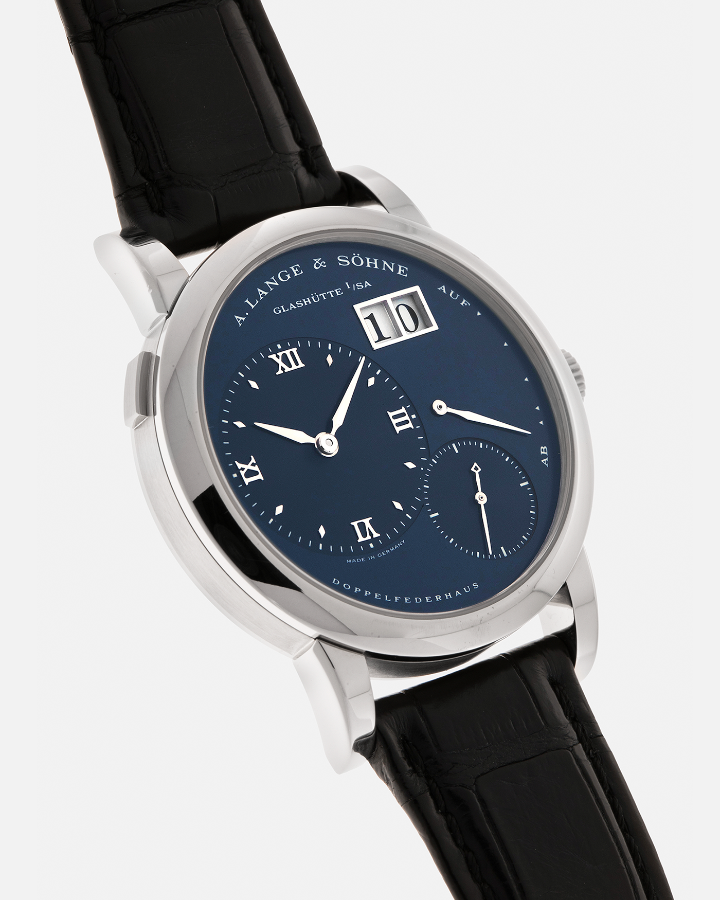 Brand: A. Lange & Söhne
Year: 2000’s
Model: Lange 1
Reference Number: 101.027
Material: 18-carat White Gold
Movement: A. Lange & Söhne Cal. L901.0, Manual Winding
Case Dimensions: 38.5mm x 9.5mm (Lug-to-Lug 47mm)
Lug Width: 20mm
Strap: A. Lange & Söhne Black Alligator Leather Strap with Signed 18-carat White Gold Tang Buckle