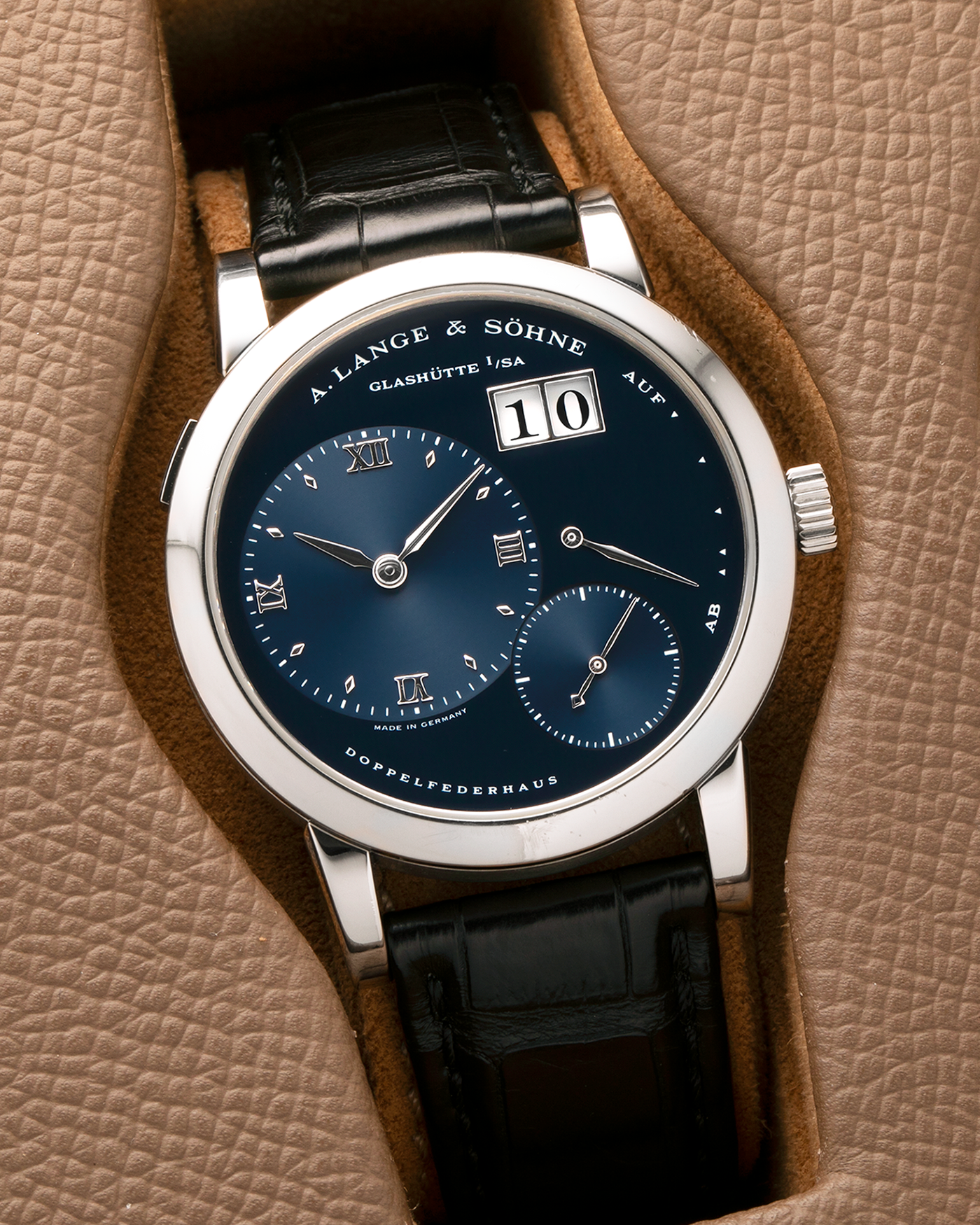 Brand: A. Lange & Söhne
Year: 2000’s
Model: Lange 1
Reference Number: 101.027
Material: 18-carat White Gold
Movement: A. Lange & Söhne Cal. L901.0, Manual Winding
Case Dimensions: 38.5mm x 9.5mm (Lug-to-Lug 47mm)
Lug Width: 20mm
Strap: A. Lange & Söhne Black Alligator Leather Strap with Signed 18-carat White Gold Tang Buckle