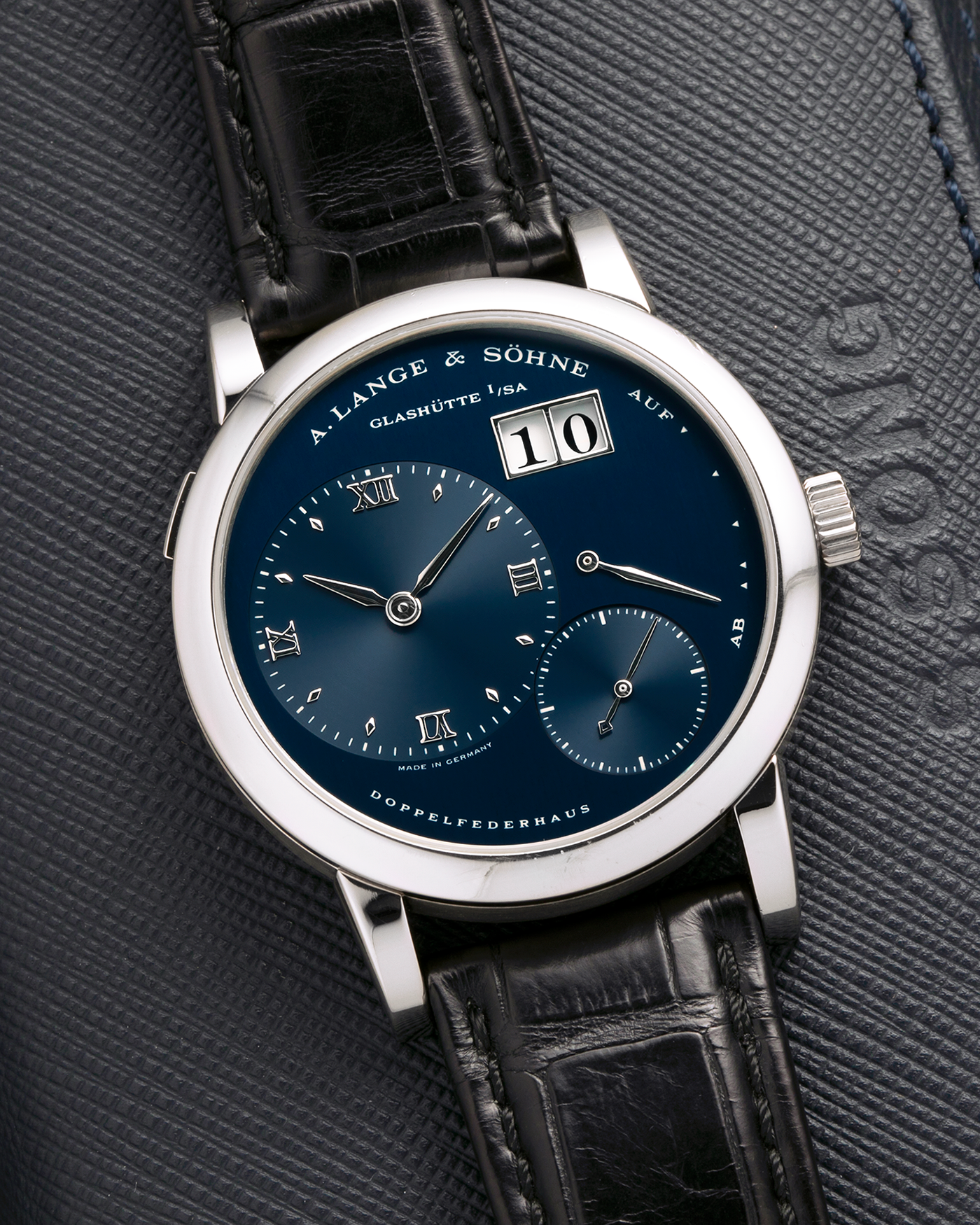 Brand: A. Lange & Söhne
Year: 2000’s
Model: Lange 1
Reference Number: 101.027
Material: 18-carat White Gold
Movement: A. Lange & Söhne Cal. L901.0, Manual Winding
Case Dimensions: 38.5mm x 9.5mm (Lug-to-Lug 47mm)
Lug Width: 20mm
Strap: A. Lange & Söhne Black Alligator Leather Strap with Signed 18-carat White Gold Tang Buckle