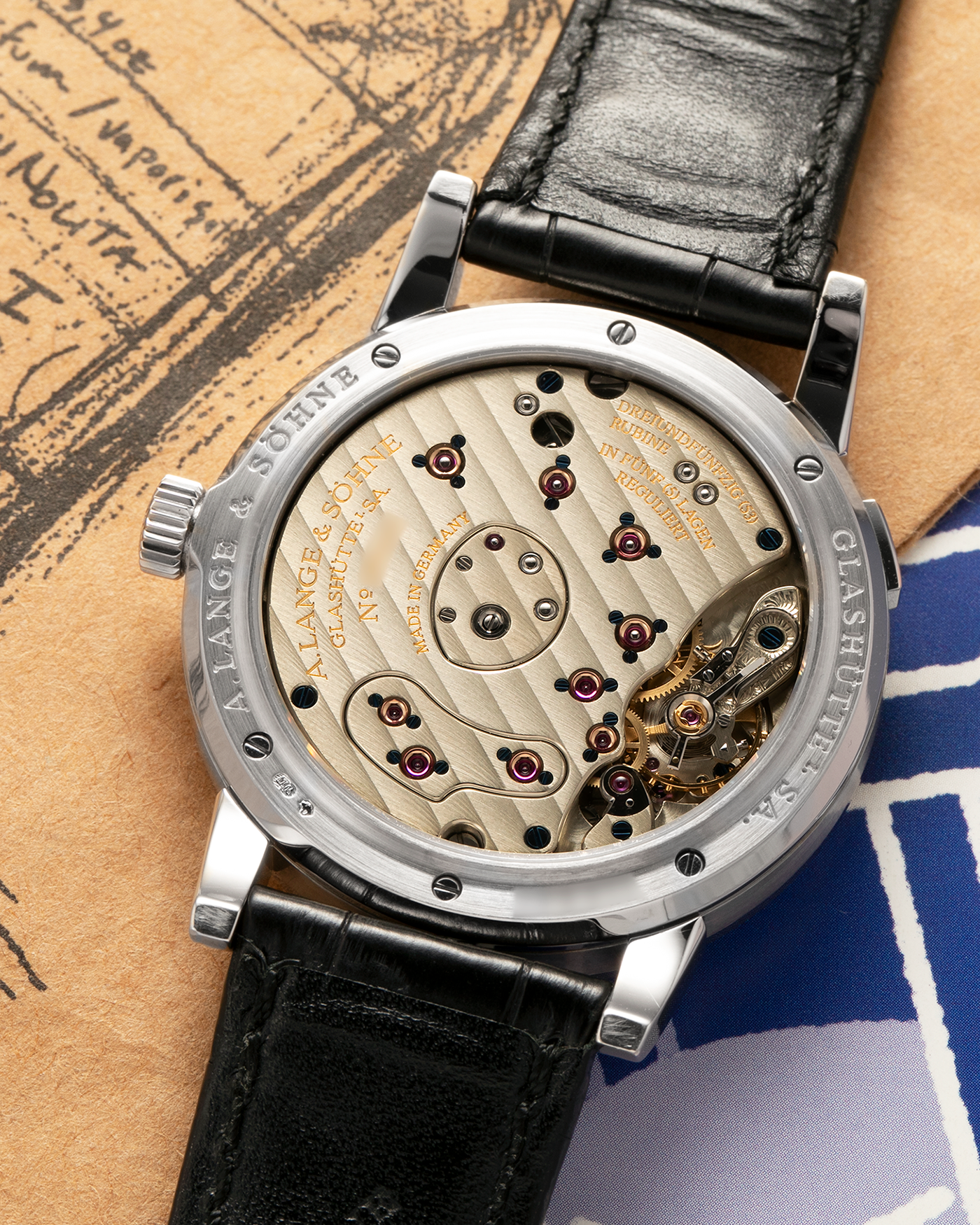 Brand: A. Lange & Söhne
Year: 2000’s
Model: Lange 1
Reference Number: 101.027
Material: 18-carat White Gold
Movement: A. Lange & Söhne Cal. L901.0, Manual Winding
Case Dimensions: 38.5mm x 9.5mm (Lug-to-Lug 47mm)
Lug Width: 20mm
Strap: A. Lange & Söhne Black Alligator Leather Strap with Signed 18-carat White Gold Tang Buckle