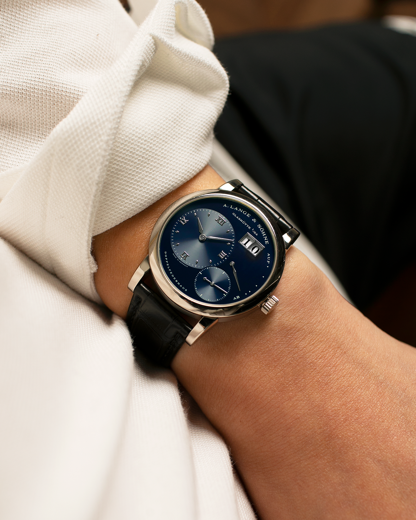 Brand: A. Lange & Söhne
Year: 2000’s
Model: Lange 1
Reference Number: 101.027
Material: 18-carat White Gold
Movement: A. Lange & Söhne Cal. L901.0, Manual Winding
Case Dimensions: 38.5mm x 9.5mm (Lug-to-Lug 47mm)
Lug Width: 20mm
Strap: A. Lange & Söhne Black Alligator Leather Strap with Signed 18-carat White Gold Tang Buckle