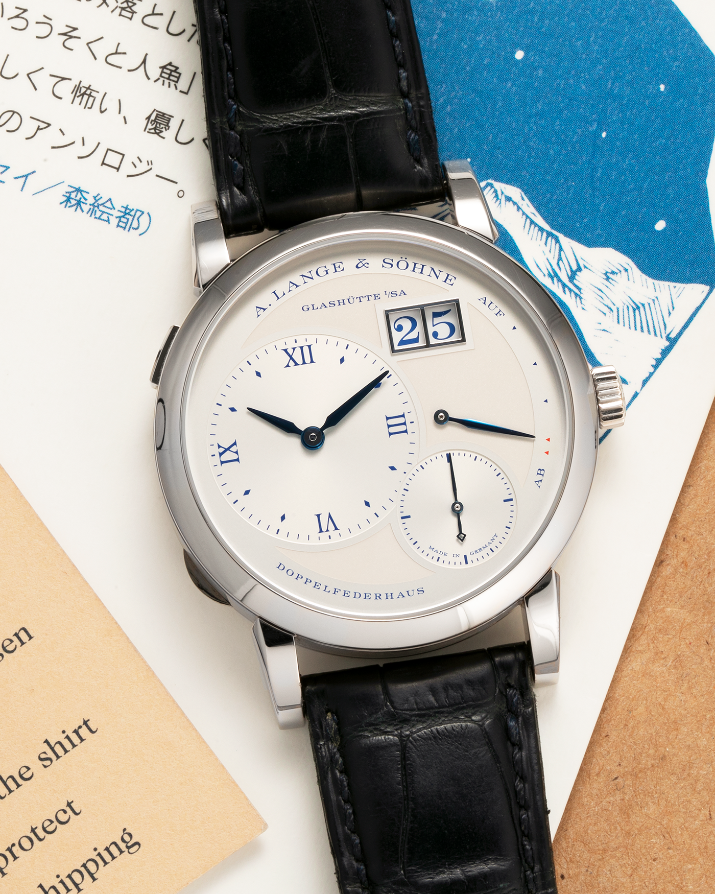 Brand: A. Lange & Söhne
Year: 2019
Model: Lange 1 Edition 25th Anniversary
Reference Number: 191.066
Material: 18-carat White Gold
Movement: A. Lange & Söhne Cal. L121.1, Manual-Winding
Case Dimensions: 38.5mm x 10.7mm (Lug-to-Lug 47.5mm)
Lug Width: 20mm
Strap: A. Lange & Söhne Black Alligator Leather Strap with Signed 18-carat White Gold Tang Buckle