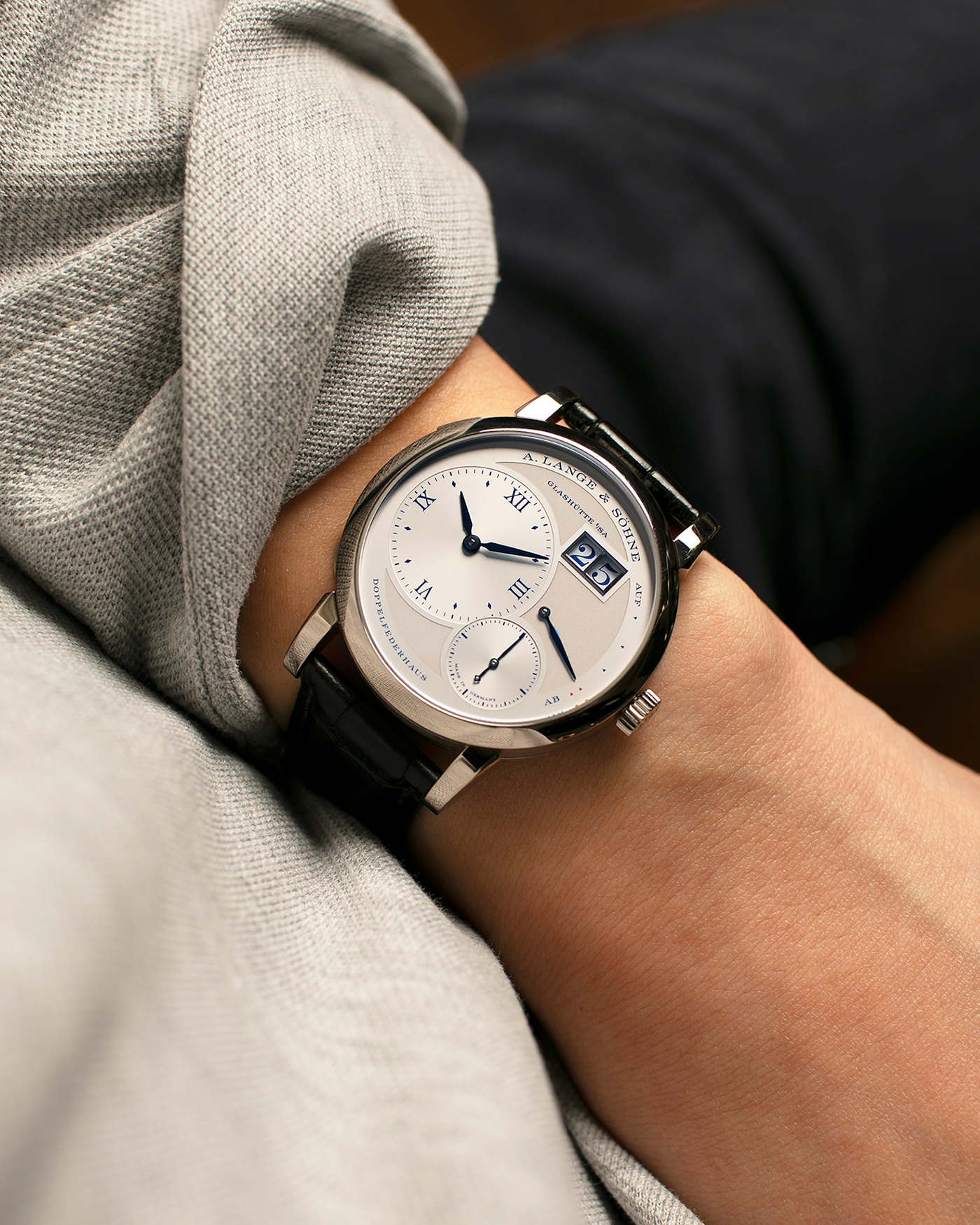 Brand: A. Lange & Söhne
Year: 2019
Model: Lange 1 Edition 25th Anniversary
Reference Number: 191.066
Material: 18-carat White Gold
Movement: A. Lange & Söhne Cal. L121.1, Manual-Winding
Case Dimensions: 38.5mm x 10.7mm (Lug-to-Lug 47.5mm)
Lug Width: 20mm
Strap: A. Lange & Söhne Black Alligator Leather Strap with Signed 18-carat White Gold Tang Buckle
