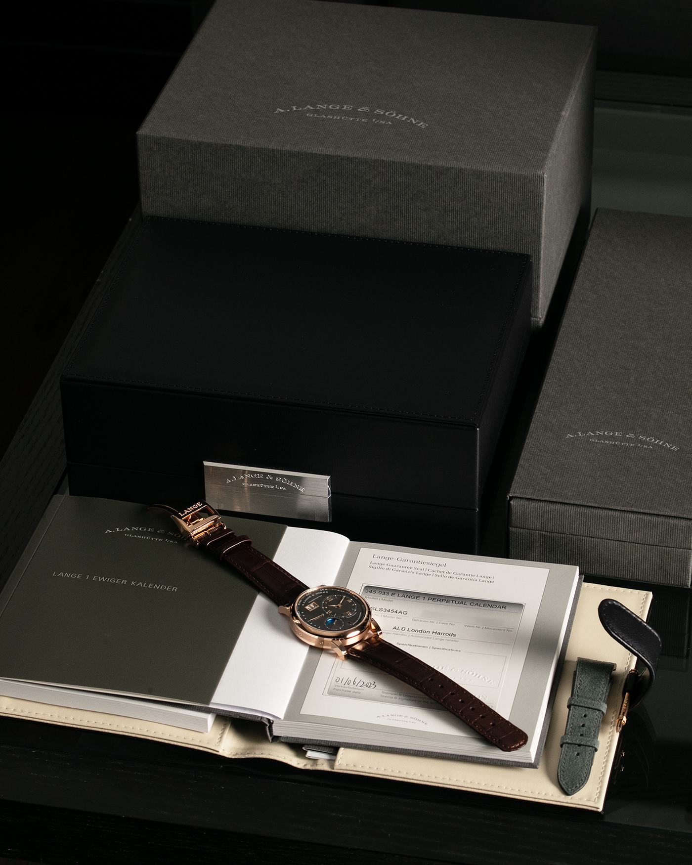 Brand: A. Lange & Söhne Year: 2022 Model: Lange 1 Perpetual Calendar Reference Number: 345.033 E Material: 18-carat Rose Gold Case Movement: A. Lange & Söhne Cal. L021.3, Self-Winding Case Dimensions: 41.9mm x 12.1mm Lug Width: 22mm Strap: A. Lange & Söhne Dark Brown Alligator Strap with 18-carat Rose Gold Tang Buckle, and additional Generic Grey Nubuck Stitched Leather Strap