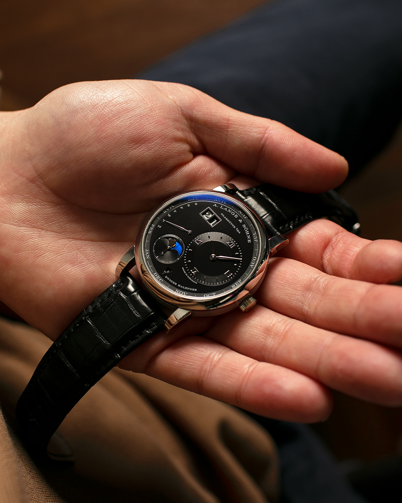 Brand: A. Lange & Söhne
Year: 2023
Model: Lange 1 Perpetual Calendar ‘Darth’
Reference Number: 345.036 E
Material: Platinum 950
Movement: A. Lange & Söhne Cal. L021.3, Self-Winding
Case Dimensions: 41.9mm x 12.1mm (Lug-to-Lug 50mm)
Lug Width: 22mm
Strap: A. Lange & Söhne Black Alligator Leather Strap with Signed Platinum 950 Tang Buckle