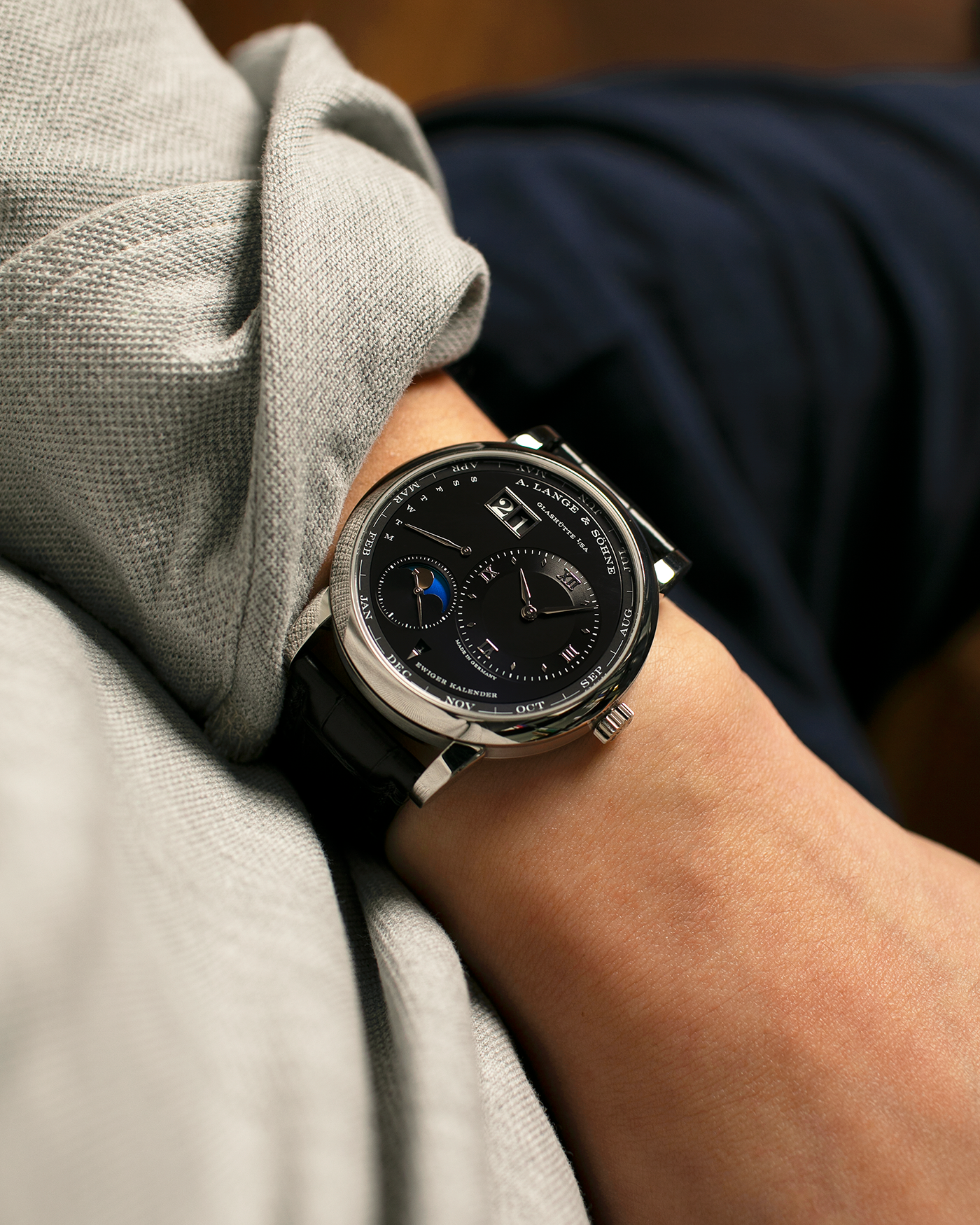 Brand: A. Lange & Söhne
Year: 2023
Model: Lange 1 Perpetual Calendar ‘Darth’
Reference Number: 345.036 E
Material: Platinum 950
Movement: A. Lange & Söhne Cal. L021.3, Self-Winding
Case Dimensions: 41.9mm x 12.1mm (Lug-to-Lug 50mm)
Lug Width: 22mm
Strap: A. Lange & Söhne Black Alligator Leather Strap with Signed Platinum 950 Tang Buckle