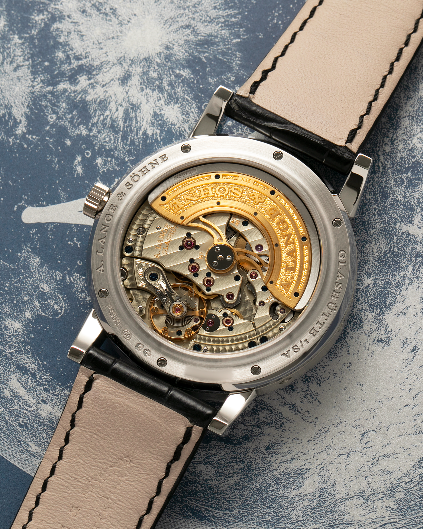 Brand: A. Lange & Söhne
Year: 2023
Model: Lange 1 Perpetual Calendar ‘Darth’
Reference Number: 345.036 E
Material: Platinum 950
Movement: A. Lange & Söhne Cal. L021.3, Self-Winding
Case Dimensions: 41.9mm x 12.1mm (Lug-to-Lug 50mm)
Lug Width: 22mm
Strap: A. Lange & Söhne Black Alligator Leather Strap with Signed Platinum 950 Tang Buckle