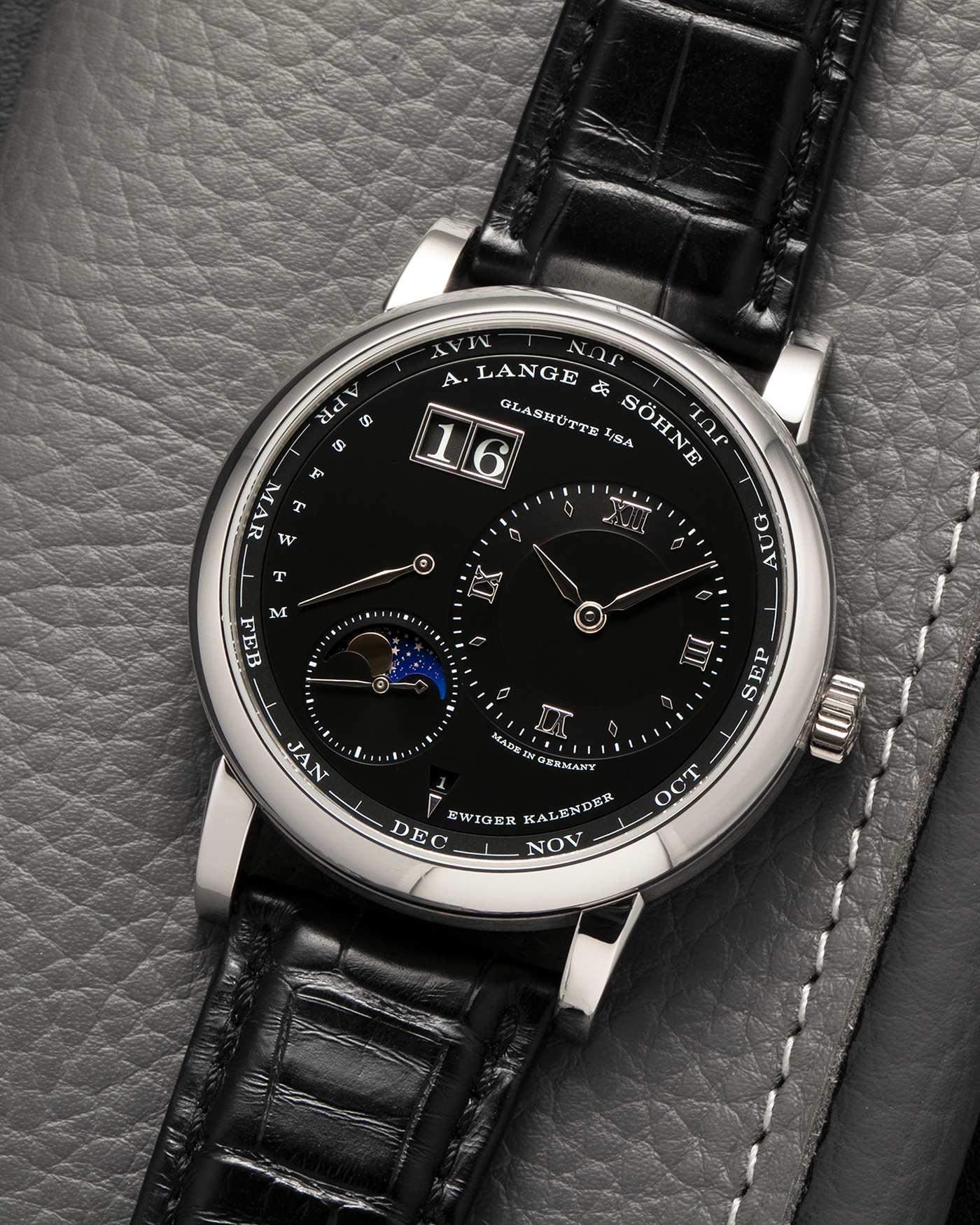 Brand: A. Lange & Söhne
Year: 2023
Model: Lange 1 Perpetual Calendar ‘Darth’
Reference Number: 345.036 E
Material: Platinum 950
Movement: A. Lange & Söhne Cal. L021.3, Self-Winding
Case Dimensions: 41.9mm x 12.1mm (Lug-to-Lug 50mm)
Lug Width: 22mm
Strap: A. Lange & Söhne Black Alligator Leather Strap with Signed Platinum 950 Tang Buckle