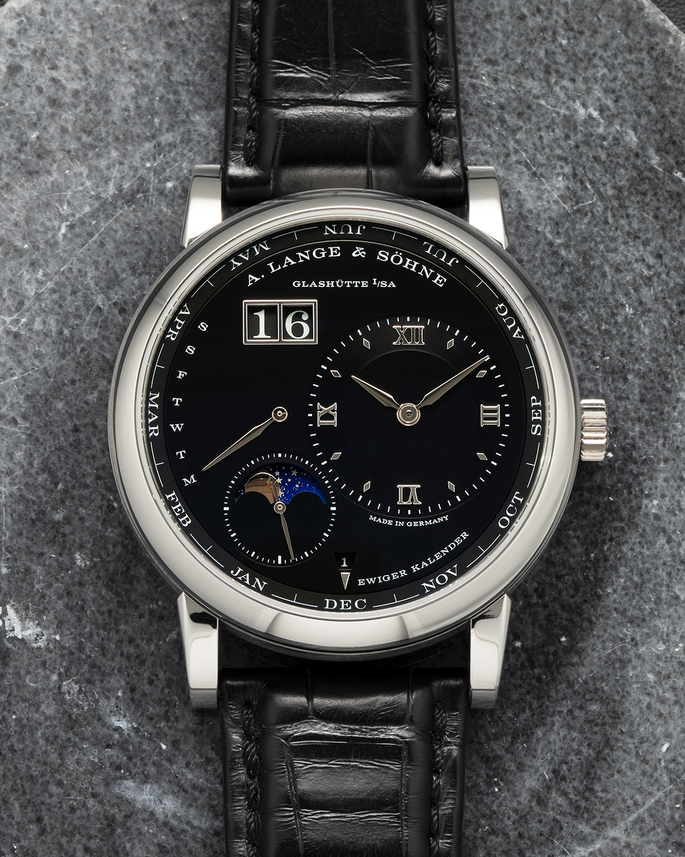 Brand: A. Lange & Söhne
Year: 2023
Model: Lange 1 Perpetual Calendar ‘Darth’
Reference Number: 345.036 E
Material: Platinum 950
Movement: A. Lange & Söhne Cal. L021.3, Self-Winding
Case Dimensions: 41.9mm x 12.1mm (Lug-to-Lug 50mm)
Lug Width: 22mm
Strap: A. Lange & Söhne Black Alligator Leather Strap with Signed Platinum 950 Tang Buckle