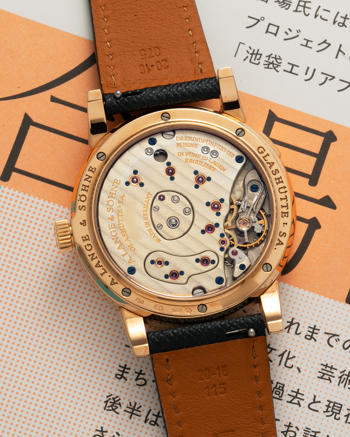 Brand: A. Lange & Sohne Year: 2000s Model: Lange 1 Reference: 101.032 Material: 18-carat Rose Gold, German Silver Movement: A. Lange & Söhne Cal. L901.0, Manual-Winding Case Diameter: 38.5mm Lug Width: 20mm Strap: Molequin Navy Blue Textured Calf Leather Strap with Signed 18-carat Rose Gold Tang Buckle, with additional A. Lange & Söhne Black Alligator Leather Strap (Used)