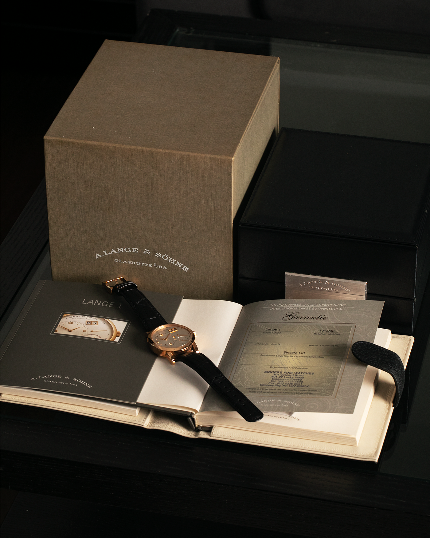 Brand: A. Lange & Sohne Year: 2000s Model: Lange 1 Reference: 101.032 Material: 18-carat Rose Gold, German Silver Movement: A. Lange & Söhne Cal. L901.0, Manual-Winding Case Diameter: 38.5mm Lug Width: 20mm Strap: Molequin Navy Blue Textured Calf Leather Strap with Signed 18-carat Rose Gold Tang Buckle, with additional A. Lange & Söhne Black Alligator Leather Strap (Used)