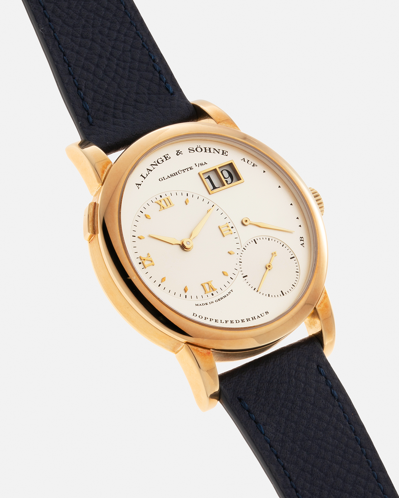 Brand: A. Lange & Söhne Year: 2019 Model: Lange 1 Reference Number: 101.021 Material: 18-carat Yellow Gold Movement: A. Lange & Söhne Cal. L901.0, Manual-Winding Case Diameter: 38.5mm x 9.8mm Lud Width: 20mm Strap: Nostime Blue Calf Leather Strap with Signed 18-carat Yellow Gold Tang Buckle, additional A. Lange & Söhne Brown Alligator Strap