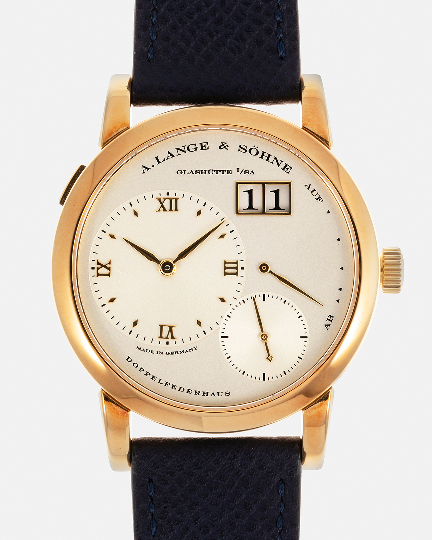 Brand: A. Lange & Söhne Year: 2019 Model: Lange 1 Reference Number: 101.021 Material: 18-carat Yellow Gold Movement: A. Lange & Söhne Cal. L901.0, Manual-Winding Case Diameter: 38.5mm x 9.8mm Lud Width: 20mm Strap: Nostime Blue Calf Leather Strap with Signed 18-carat Yellow Gold Tang Buckle, additional A. Lange & Söhne Brown Alligator Strap