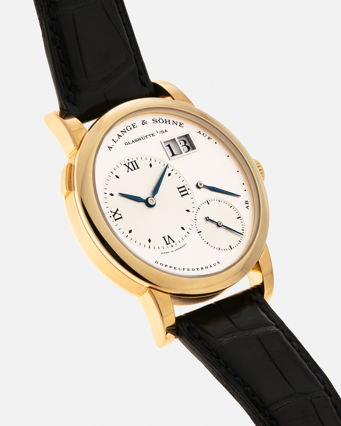 Brand: A. Lange & Söhne Year: 2000s Model: Lange 1 Reference: 101.022 Material: 18-carat Yellow Gold, German Silver Movement: A. Lange & Söhne Cal. L901.0, Manual-Winding Case Diameter: 38.5mm Lug Width: 20mm Strap: A. Lange & Söhne Black Alligator Leather Strap with Signed 18-carat Yellow Gold Tang Buckle