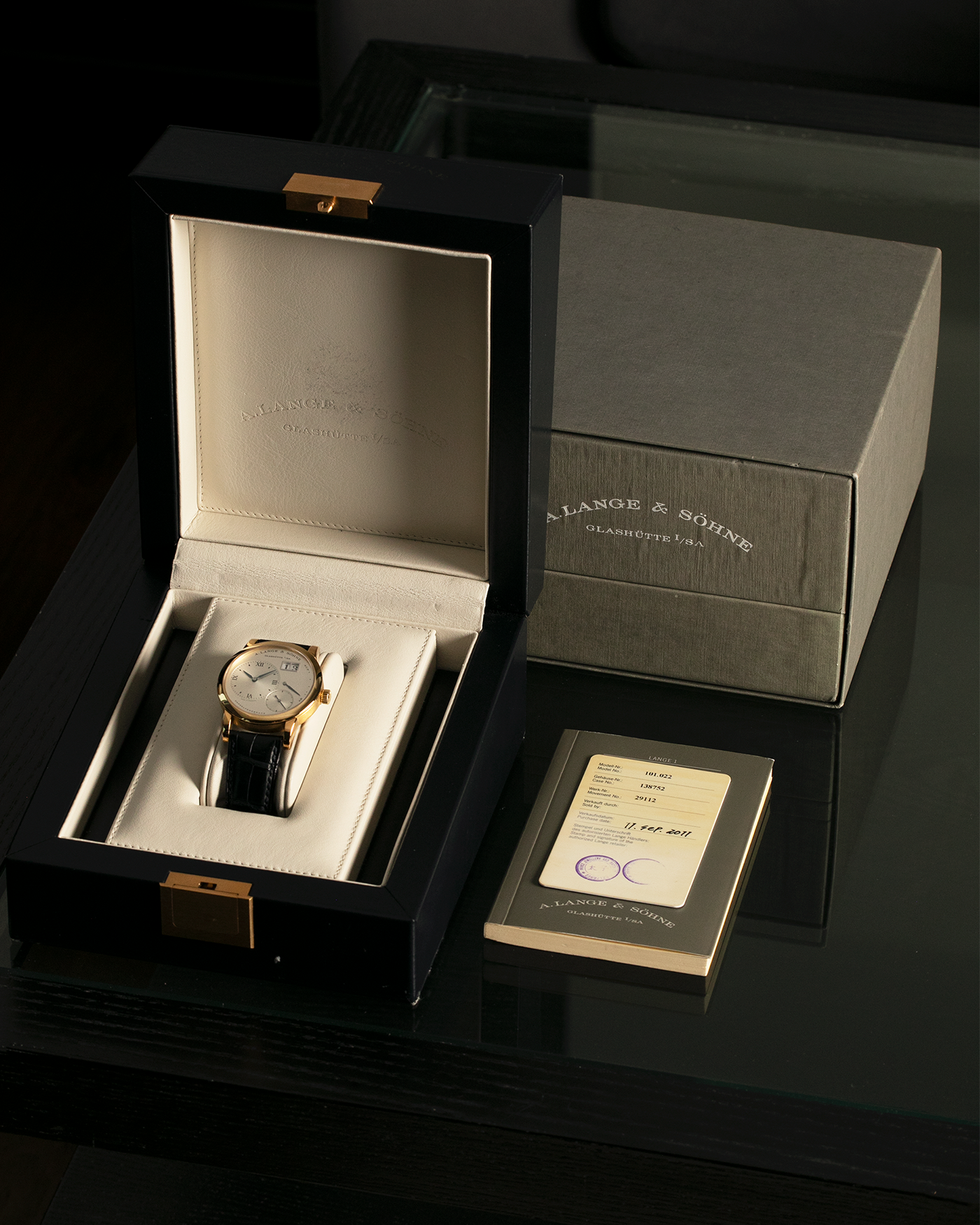 Brand: A. Lange & Söhne Year: 2000s Model: Lange 1 Reference: 101.022 Material: 18-carat Yellow Gold, German Silver Movement: A. Lange & Söhne Cal. L901.0, Manual-Winding Case Diameter: 38.5mm Lug Width: 20mm Strap: A. Lange & Söhne Black Alligator Leather Strap with Signed 18-carat Yellow Gold Tang Buckle