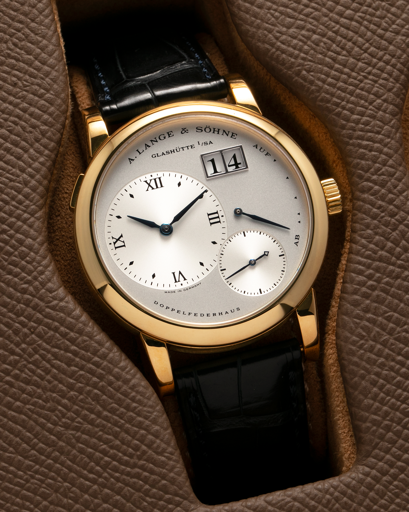 Brand: A. Lange & Söhne Year: 2000s Model: Lange 1 Reference: 101.022 Material: 18-carat Yellow Gold, German Silver Movement: A. Lange & Söhne Cal. L901.0, Manual-Winding Case Diameter: 38.5mm Lug Width: 20mm Strap: A. Lange & Söhne Black Alligator Leather Strap with Signed 18-carat Yellow Gold Tang Buckle