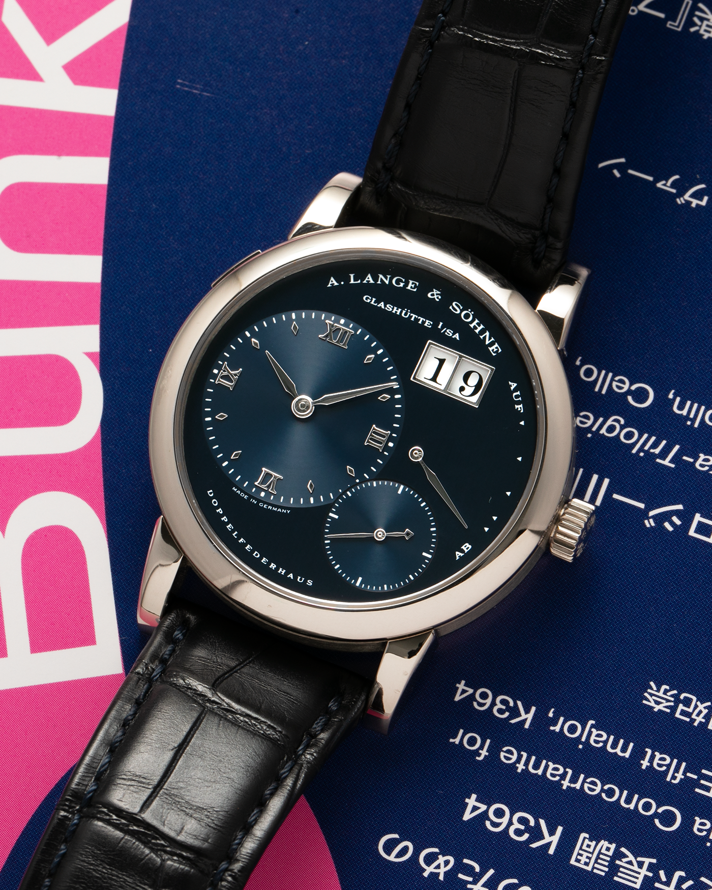 Brand: A. Lange & Söhne Year: 2000’s Model: Lange 1 Reference Number: 101.027 Material: 18-carat White Gold Movement: A. Lange & Söhne Cal. L901.5, Manual Winding Case Diameter: 38.5mm Strap: A. Lange & Söhne Black Alligator Leather Strap with Signed 18-carat White Gold Tang Buckle