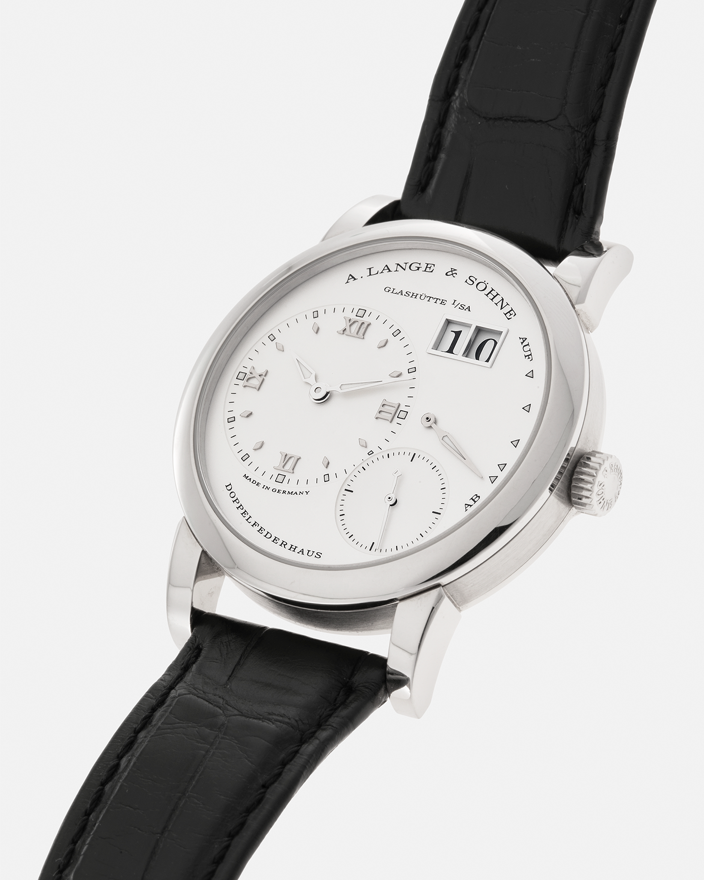 Brand: A. Lange & Söhne
Year: 2010s
Model: Lange 1
Reference: 101.039
Material: 18-carat White Gold
Movement: A. Lange & Söhne Cal. L901.0, Manual-Winding
Case Dimensions: 38.5mm x 9.8mm (Lug-to-Lug 47.3mm)
Lug Width: 20mm
Strap: A. Lange & Söhne Black Alligator Leather Strap with Signed 18-carat White Gold Tang Buckle