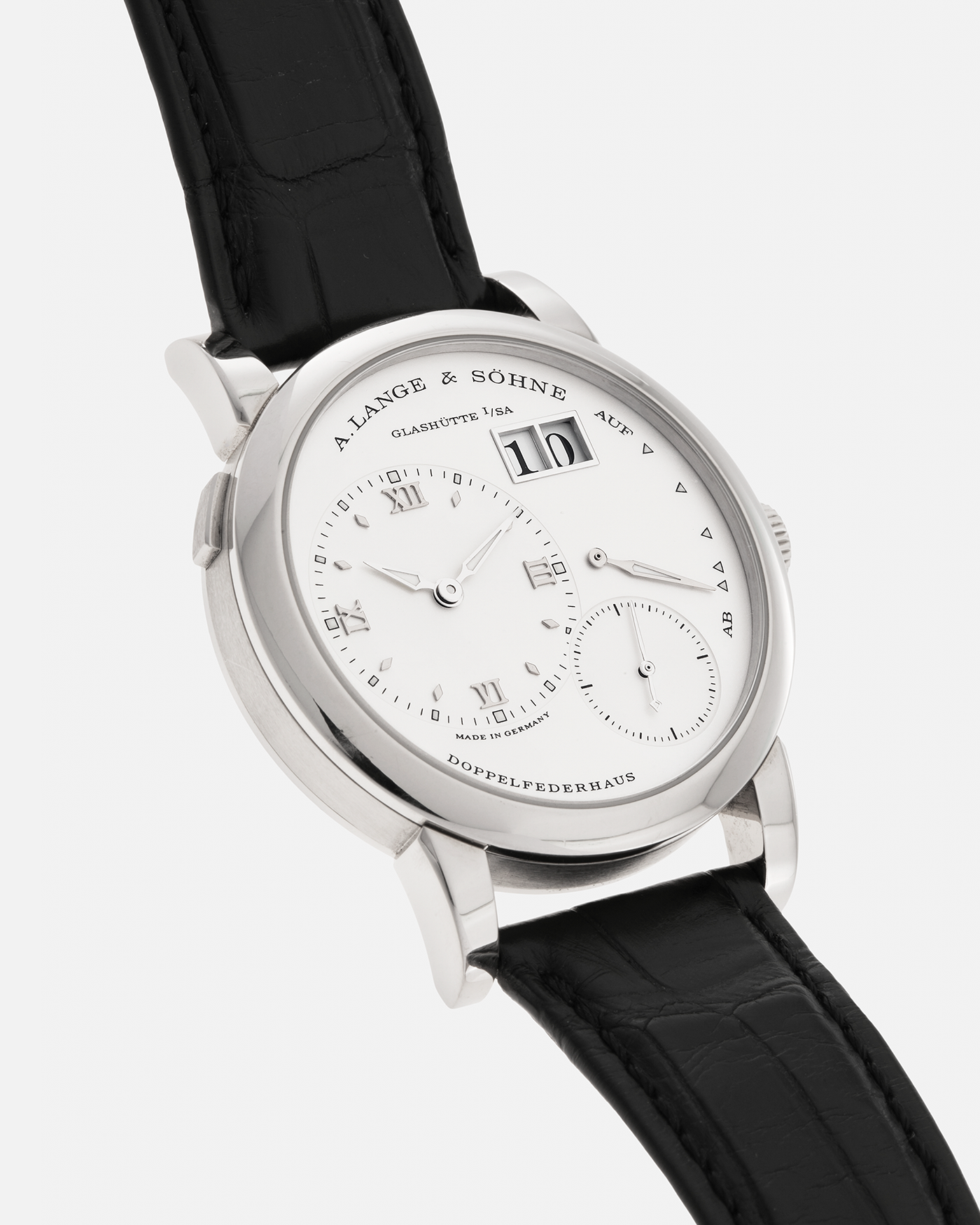 Brand: A. Lange & Söhne
Year: 2010s
Model: Lange 1
Reference: 101.039
Material: 18-carat White Gold
Movement: A. Lange & Söhne Cal. L901.0, Manual-Winding
Case Dimensions: 38.5mm x 9.8mm (Lug-to-Lug 47.3mm)
Lug Width: 20mm
Strap: A. Lange & Söhne Black Alligator Leather Strap with Signed 18-carat White Gold Tang Buckle