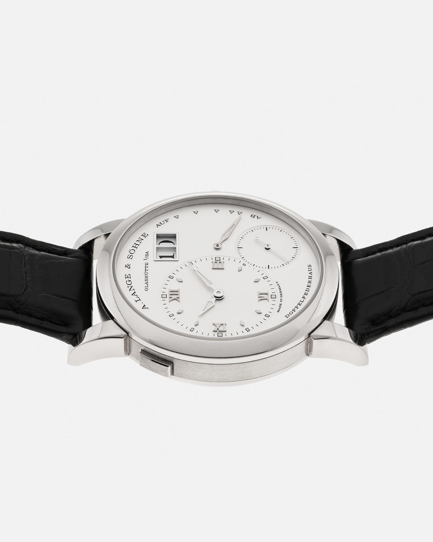 Brand: A. Lange & Söhne
Year: 2010s
Model: Lange 1
Reference: 101.039
Material: 18-carat White Gold
Movement: A. Lange & Söhne Cal. L901.0, Manual-Winding
Case Dimensions: 38.5mm x 9.8mm (Lug-to-Lug 47.3mm)
Lug Width: 20mm
Strap: A. Lange & Söhne Black Alligator Leather Strap with Signed 18-carat White Gold Tang Buckle