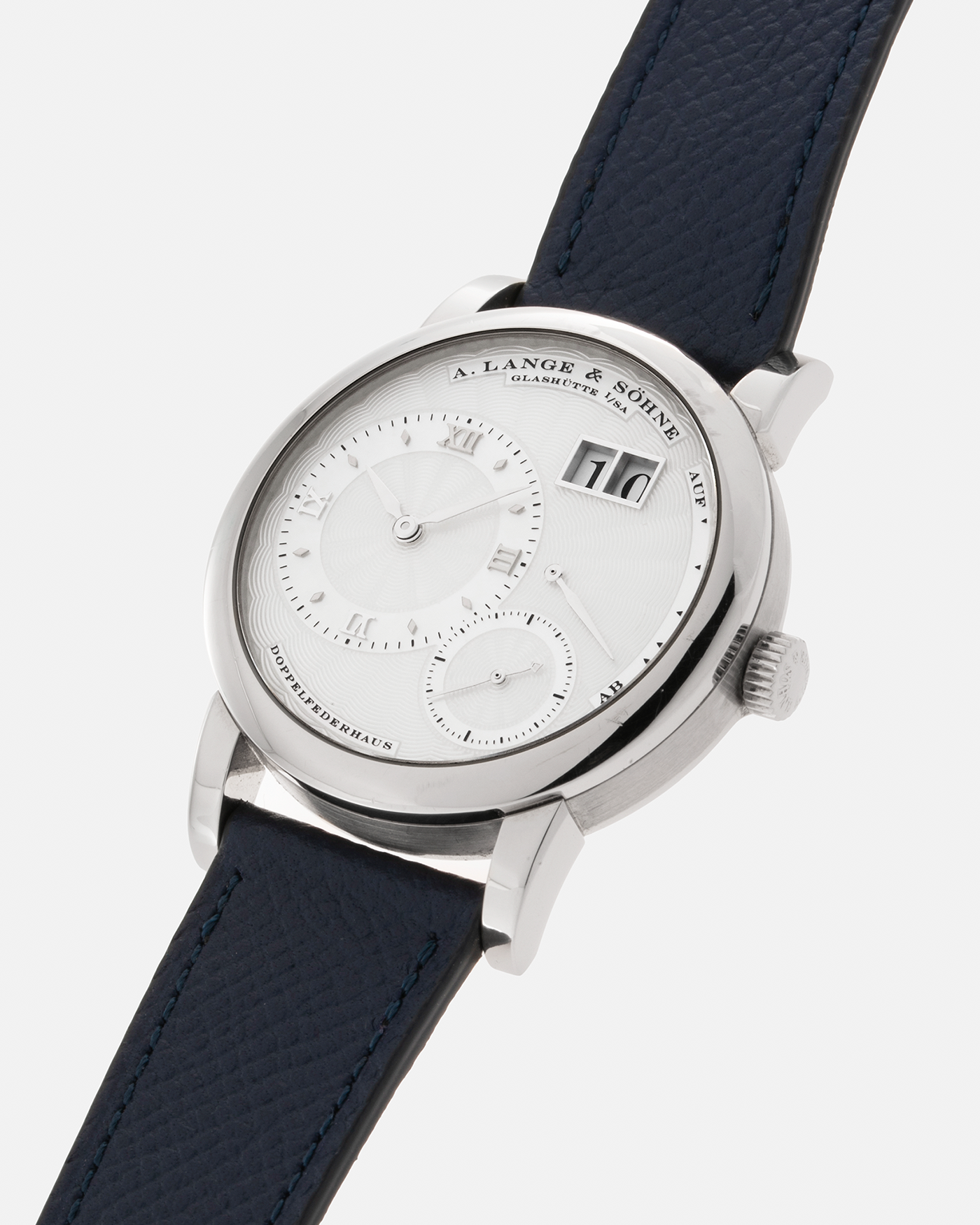 Brand: A. Lange & Söhne Year: 2000’s Model: Lange 1 Soirée Reference Number: 110.030 Material: 18-carat White Gold Movement: A. Lange & Söhne Cal. L901.5, Manual Winding Case Dimensions: 38.5mm x 9.8mm Lug Width: 20mm Strap: Nostime Navy Grained Calf Leather Strap with Signed 18-Carat White Gold Tang Buckle