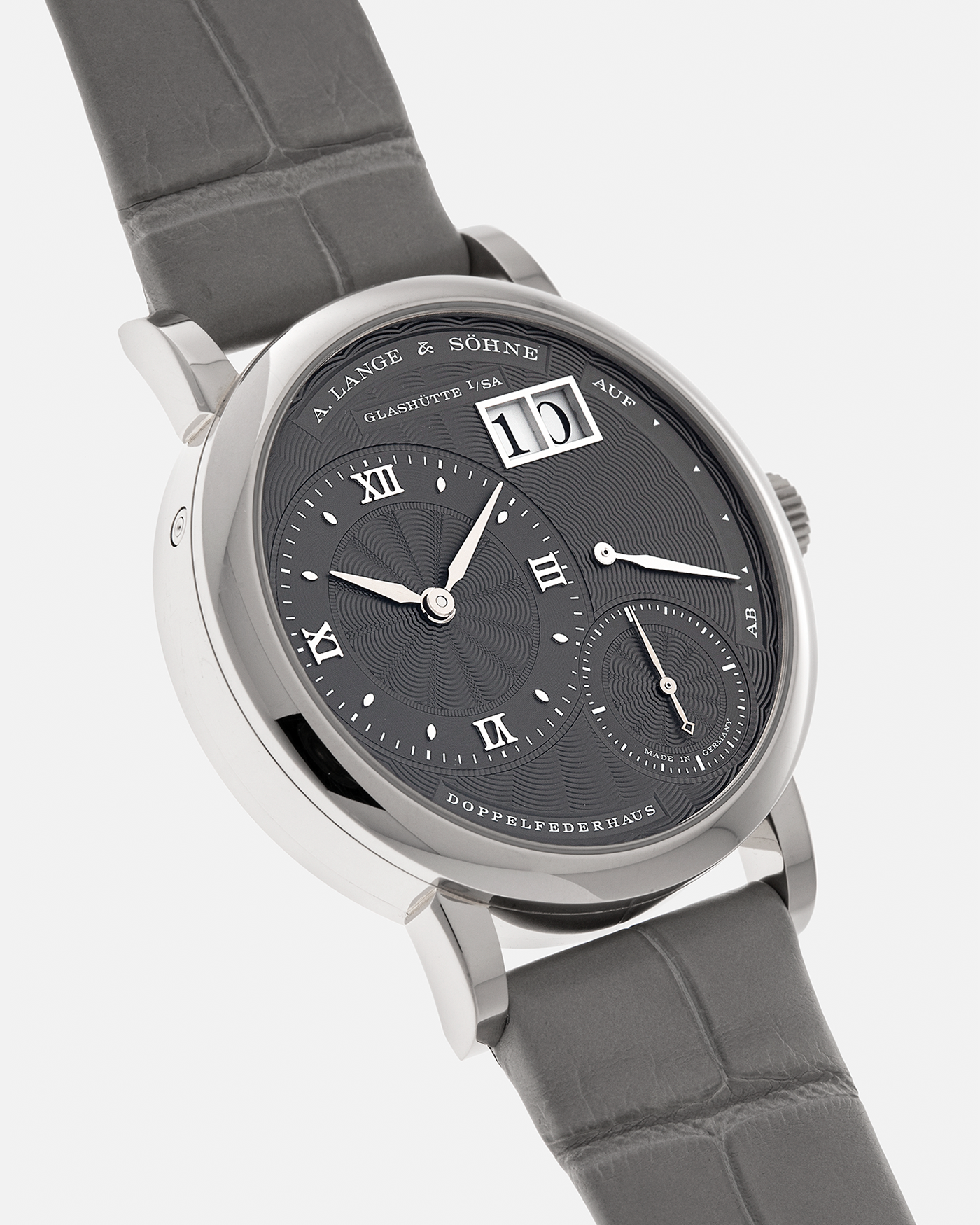 Brand: A. Lange & Söhne
Year: 2021
Model: Little Lange 1 
Reference Number: 181.038
Material: 18-carat White Gold
Movement: A. Lange & Söhne Cal. L121.1, Manual Winding
Case Dimensions: 36.8mm x 9.5mm (Lug-to-Lug 44mm)
Lug Width: 19mm
Strap: A. Lange & Söhne Light Grey Unstitched Alligator Strap with Signed 18-carat White Gold Tang Buckle
